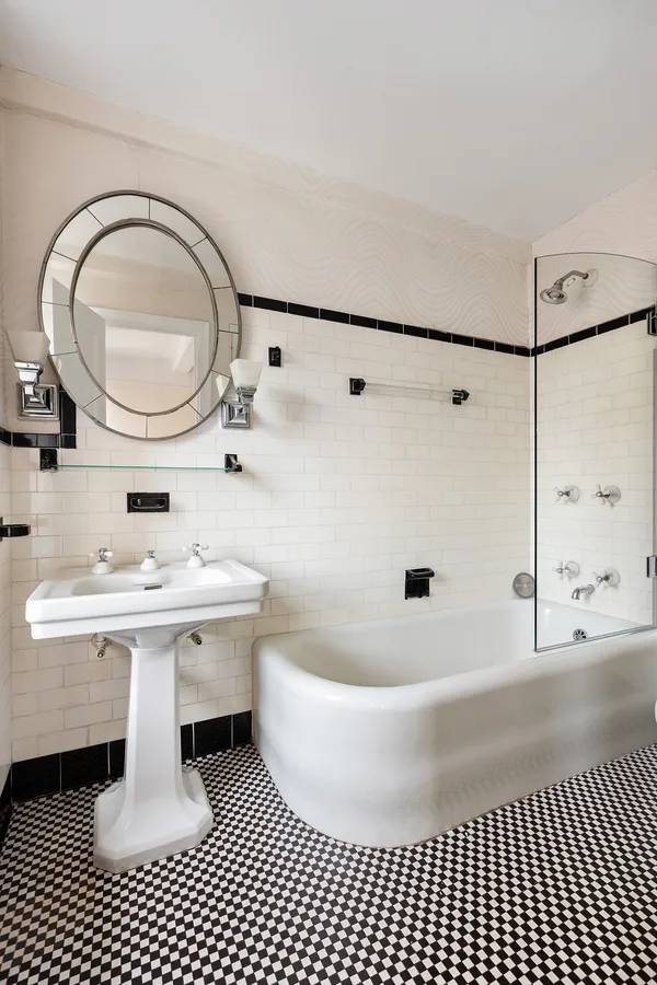 a bathroom with a sink a mirror and a shower
