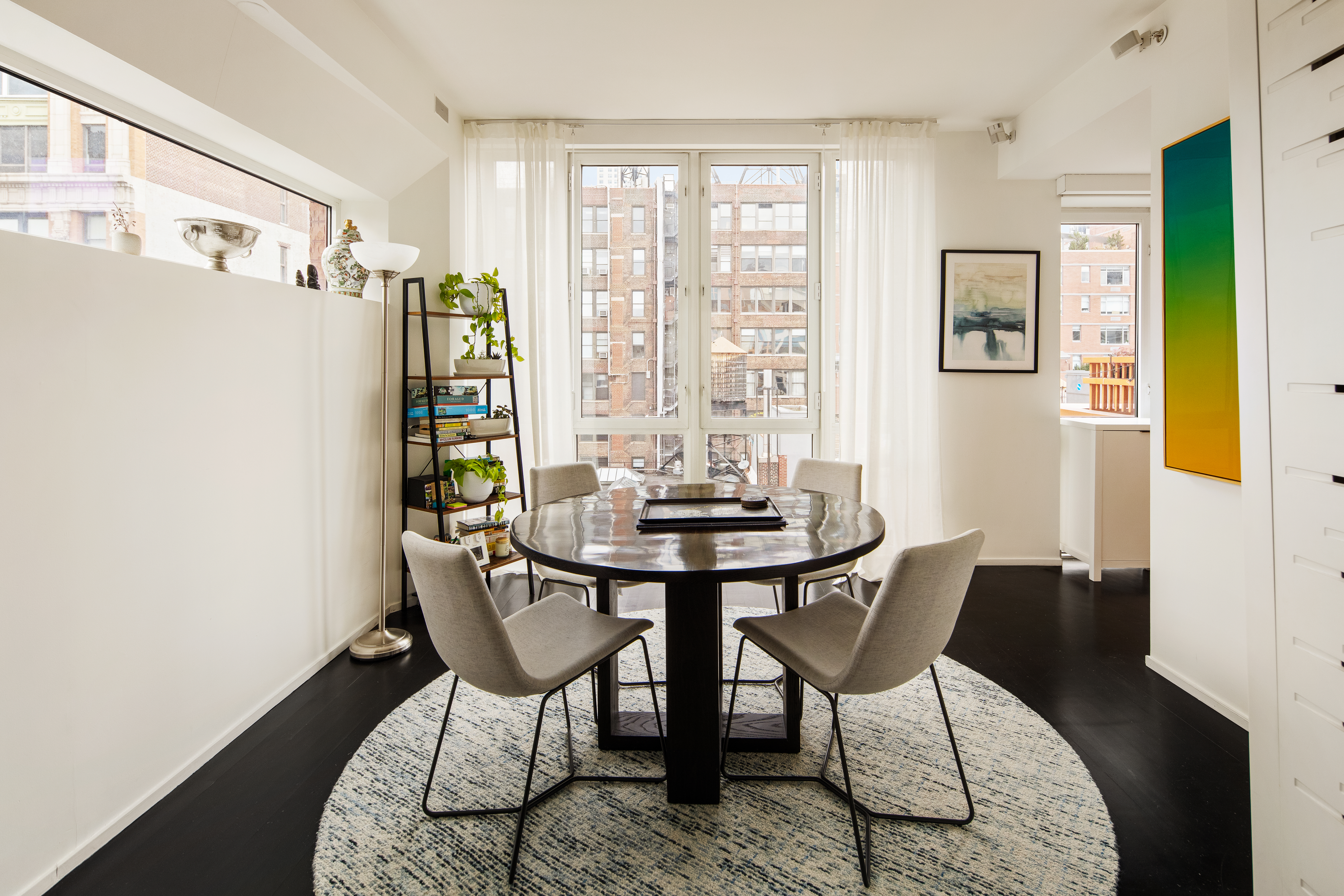 130 West 20th Street, Unit PH11A Manhattan, NY 10011 - Photo 4 of 9 a view of a dining room with furniture window and outside view
