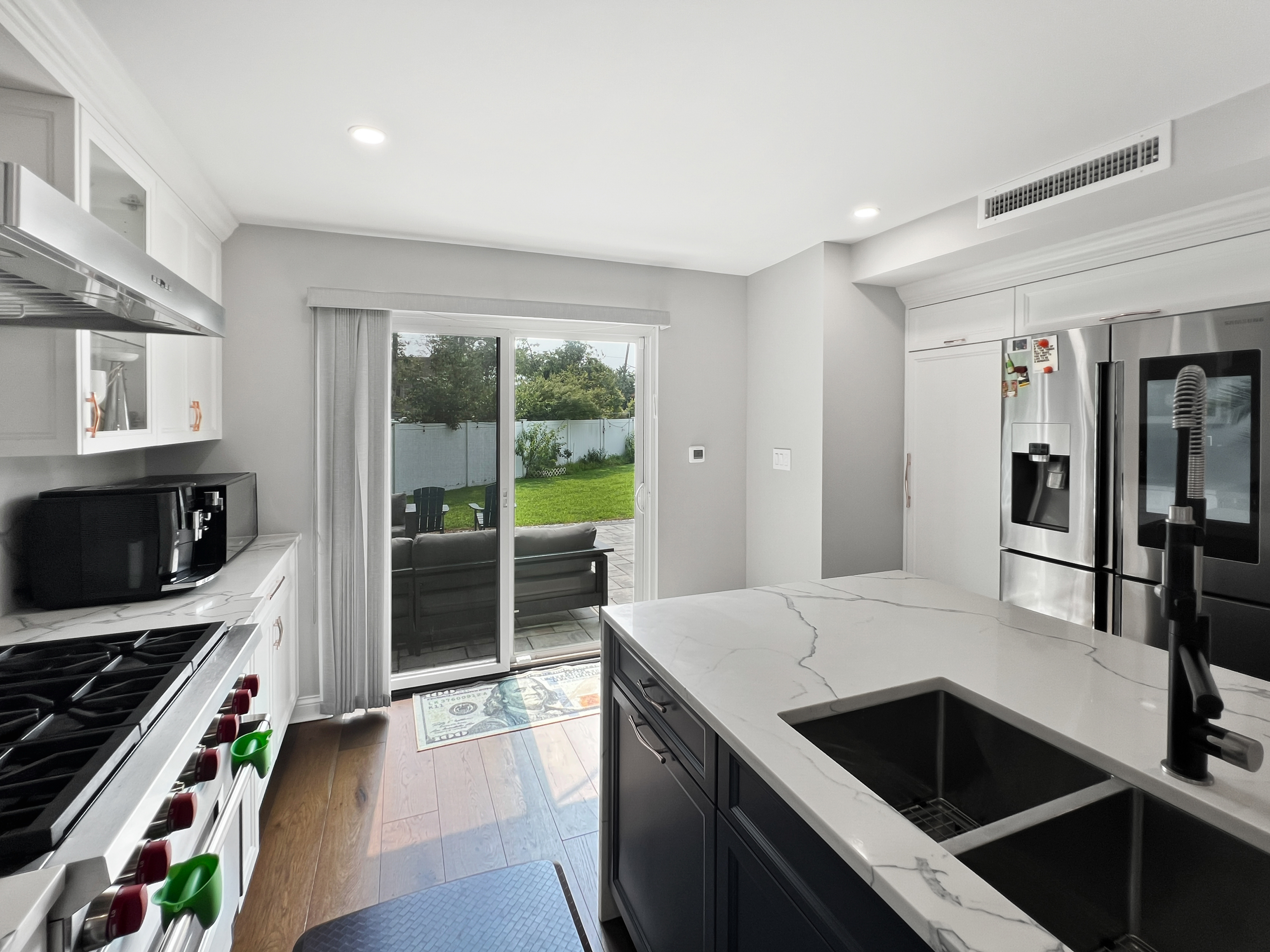 5021 Surf Avenue Brooklyn, NY 11224 - Photo 7 of 32 a kitchen with a stove and a refrigerator