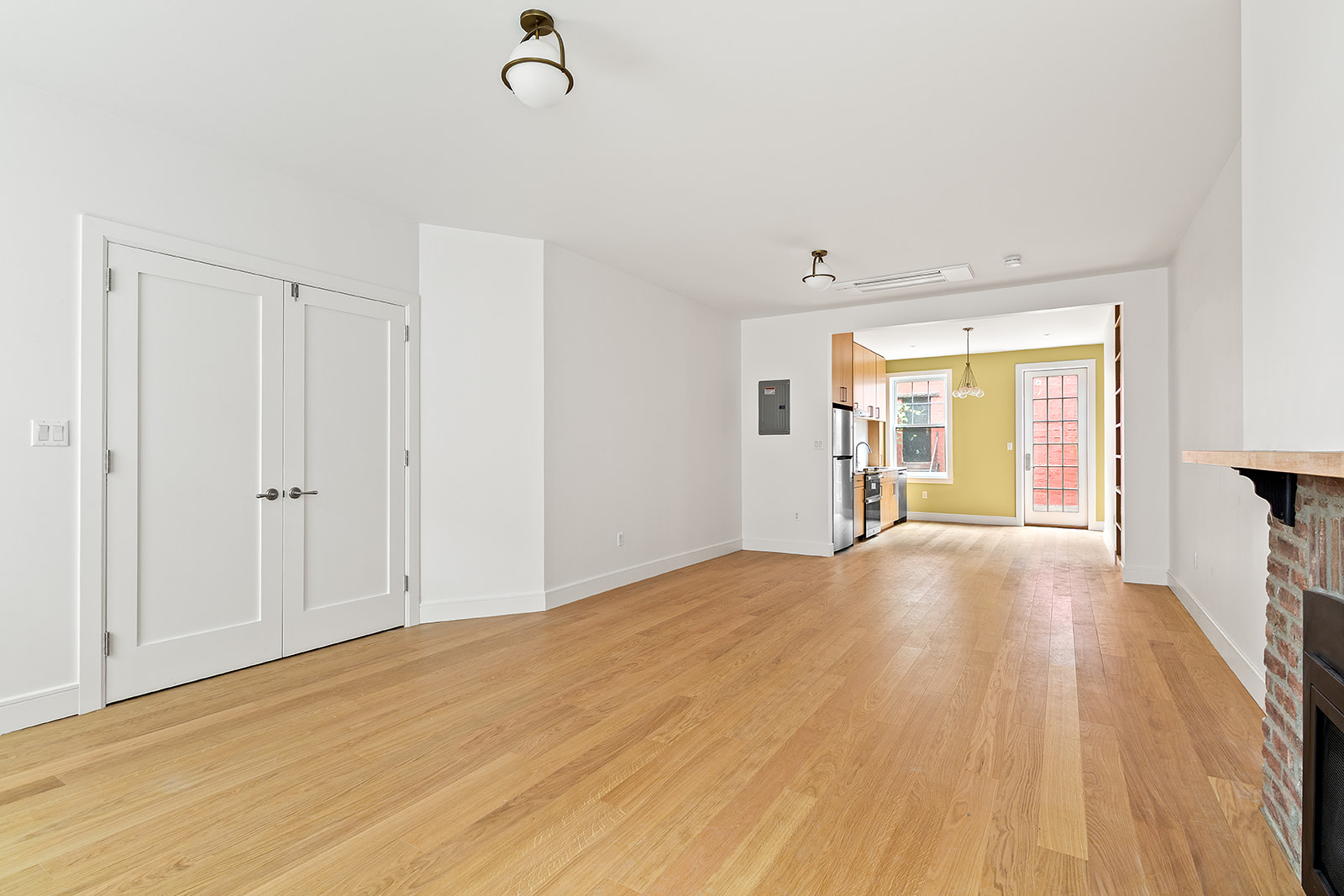 69 Hudson Avenue Brooklyn, NY 11201 - Photo 4 of 19 a view of empty room with wooden floor and fan