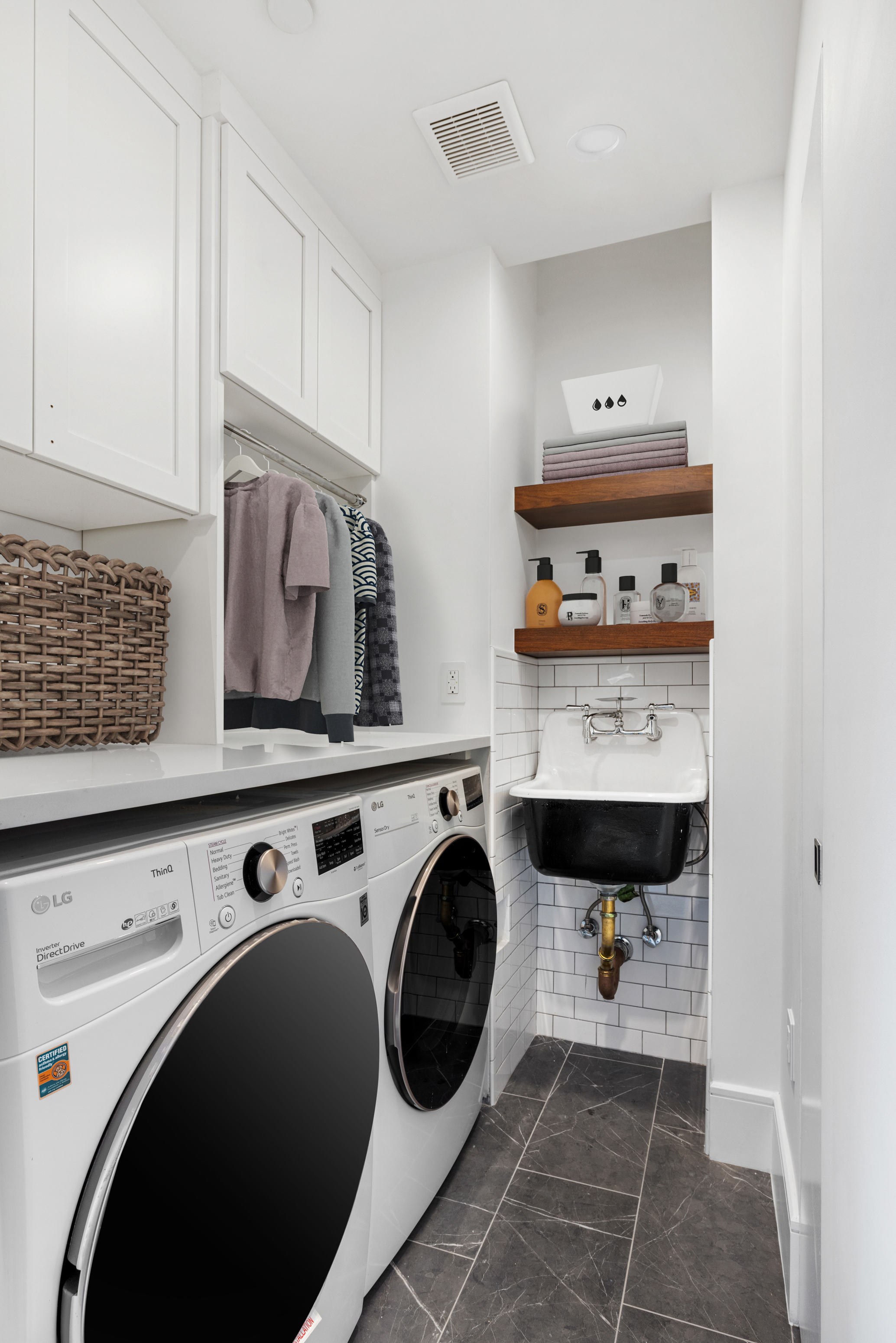 63 West 17th Street, Unit 7A Manhattan, NY 10011 - Photo 21 of 32 a utility room with dryer and washer
