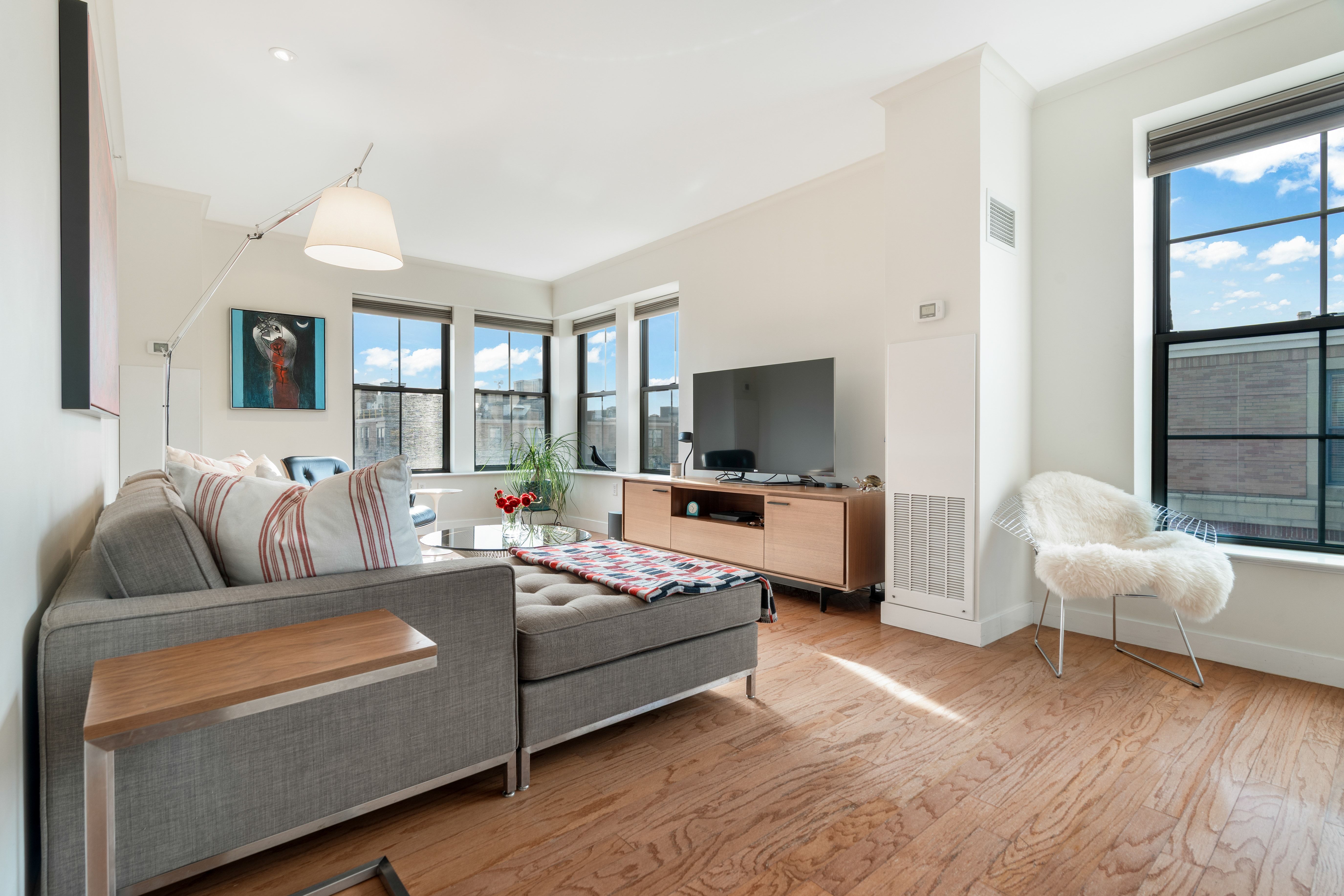 2 Rollins Street, Unit D601 Boston, MA 02118 - Photo 8 of 29 a living room with furniture and a flat screen tv