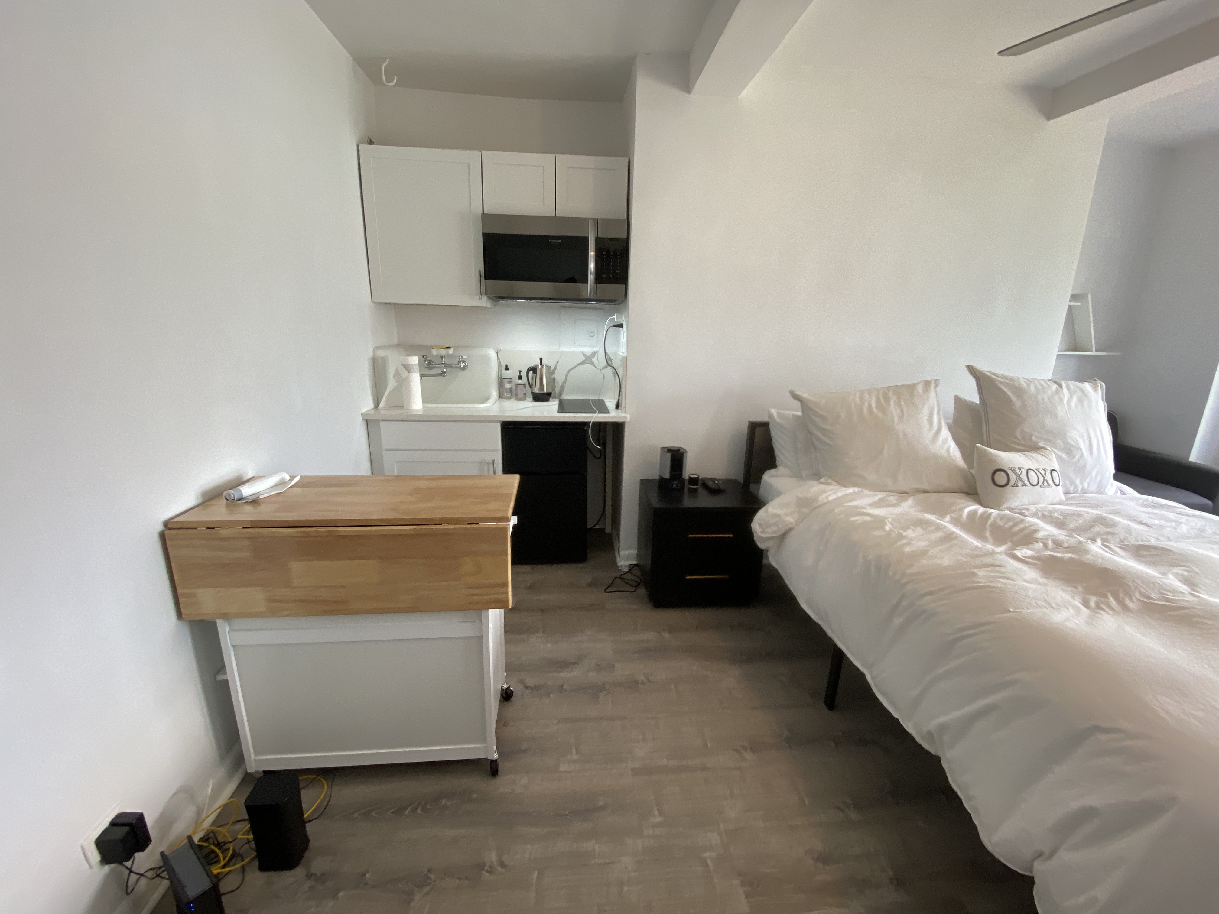 5 Tudor City Place, Unit 1226 Manhattan, NY 10017 - Photo 3 of 10 a room with a bed and a television