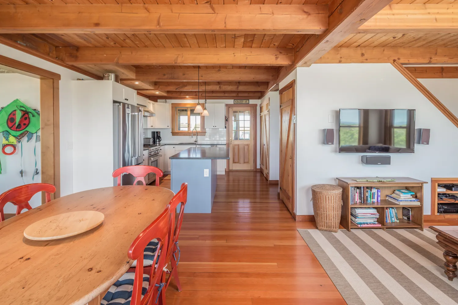a dining room with stainless steel appliances granite countertop lots of wooden furniture