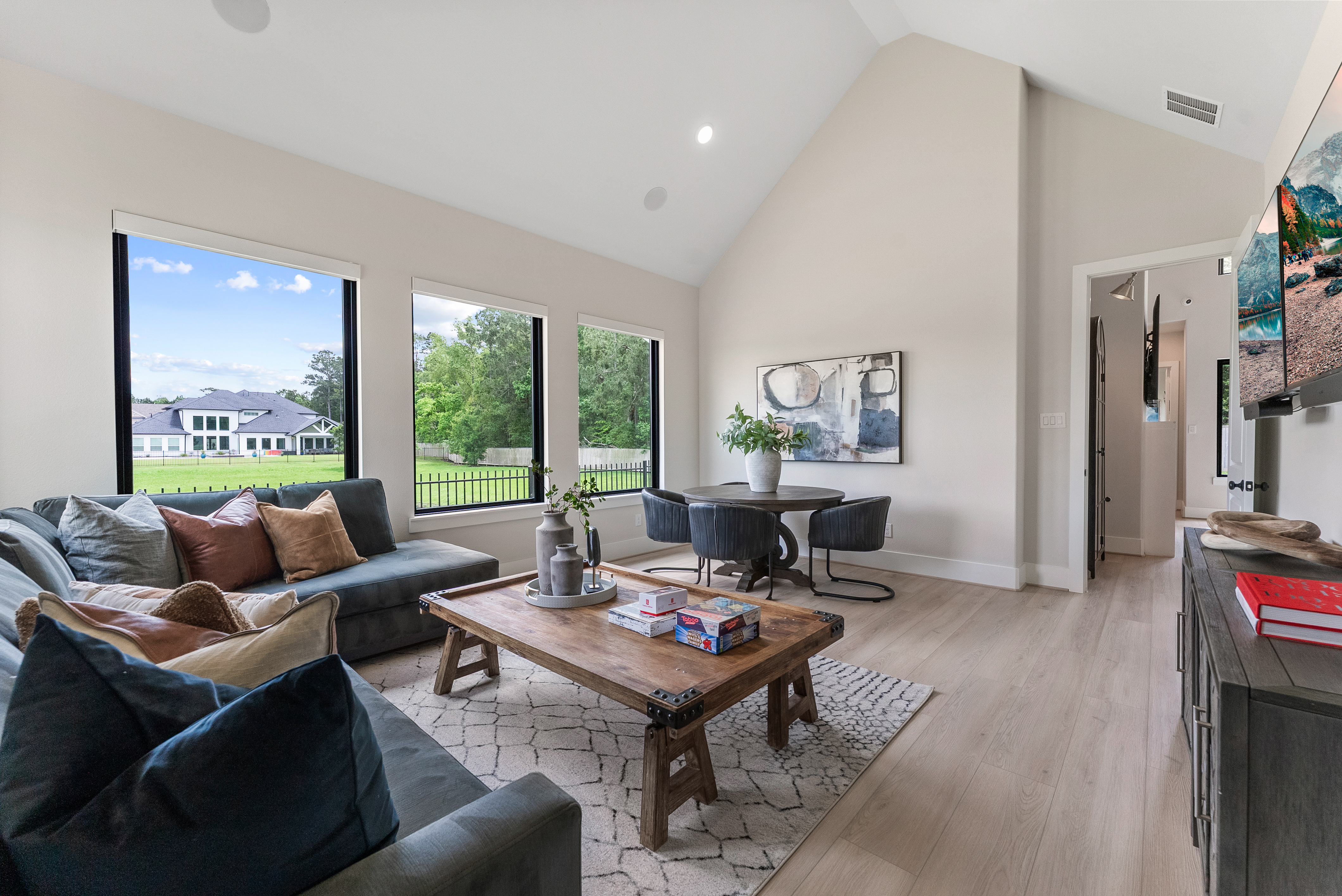 2118 Bennet Court Conroe, TX 77384 - Photo 25 of 70 a living room with furniture and a wooden floor