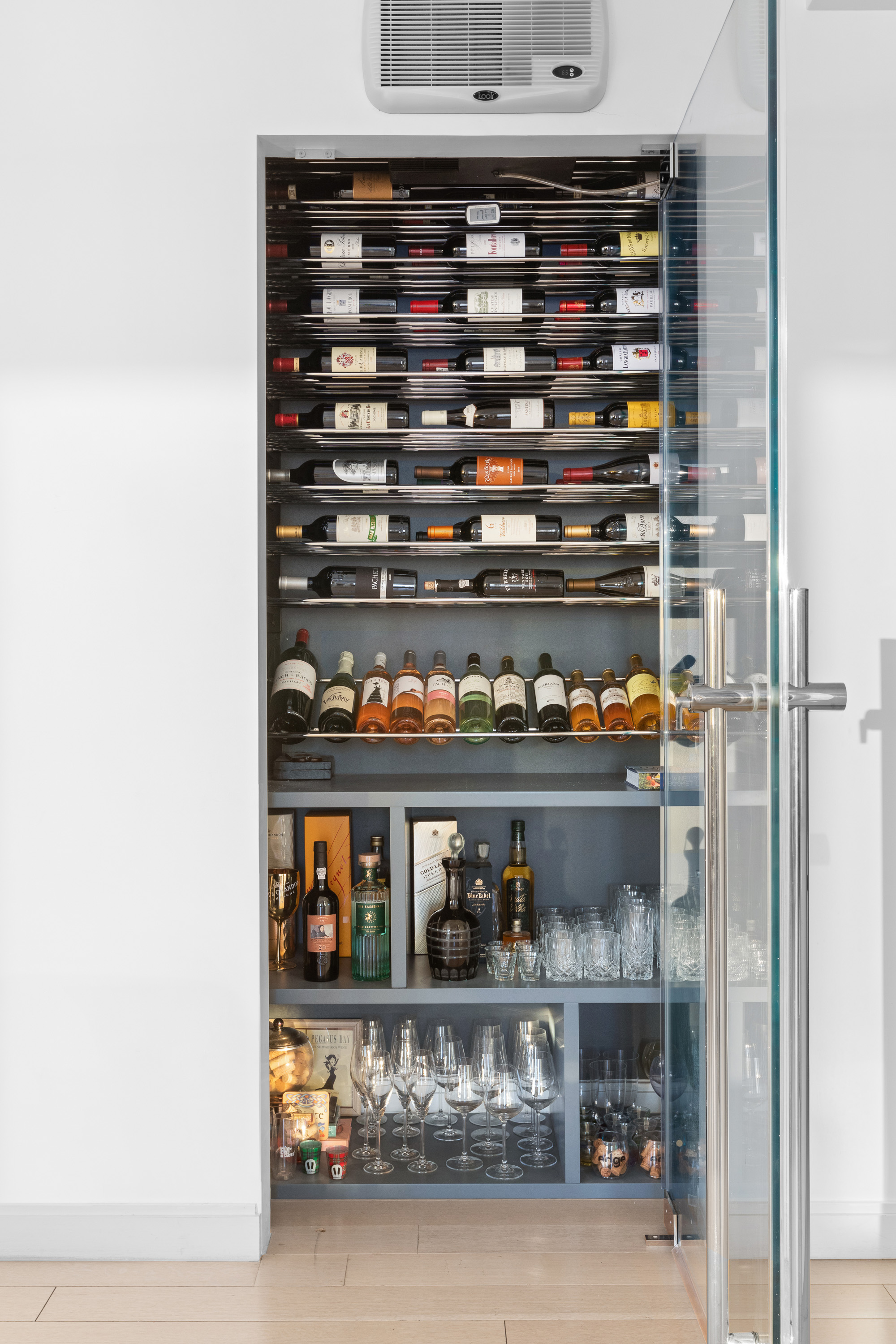 212 Warren Street, Unit 20A Manhattan, NY 10282 - Photo 9 of 23 a kitchen with a lot of cabinets and a wooden floor