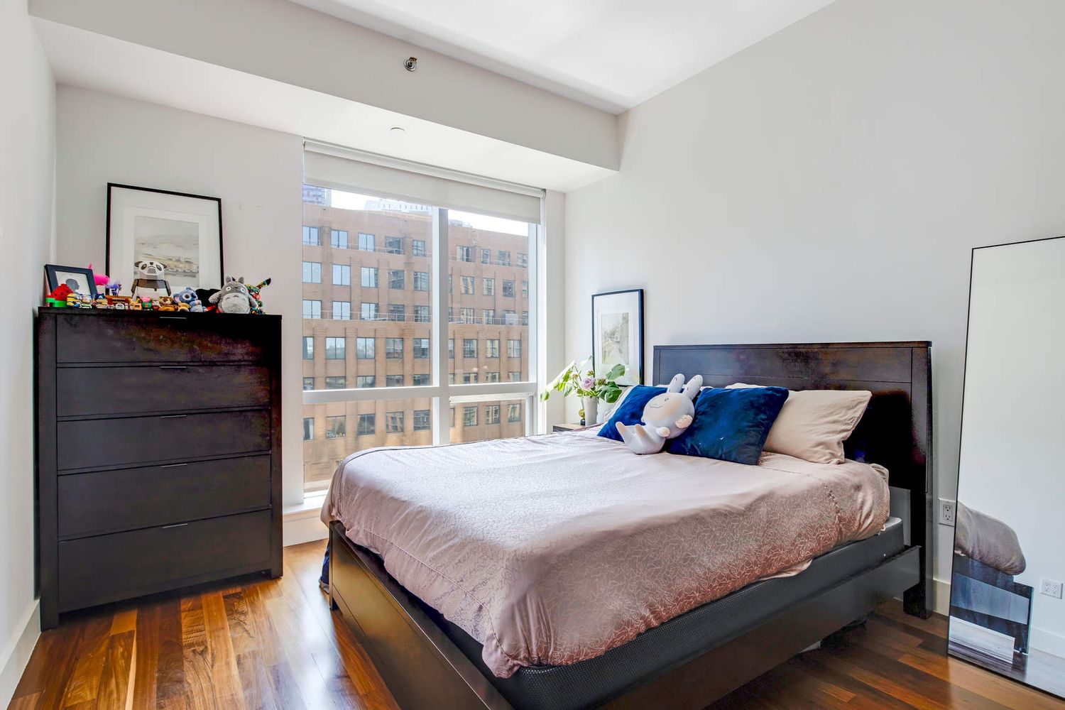 150 Myrtle Avenue, Unit 805 Brooklyn, NY 11201 - Photo 25 of 26 a bedroom with a bed and a window