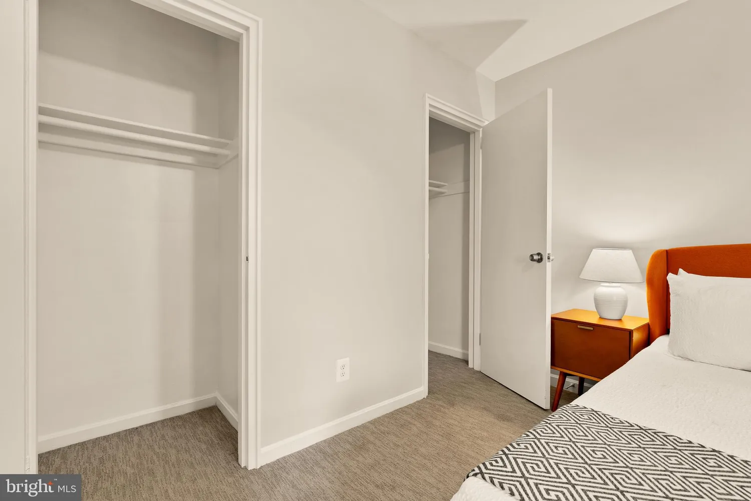 a view of room with furniture and wooden floor