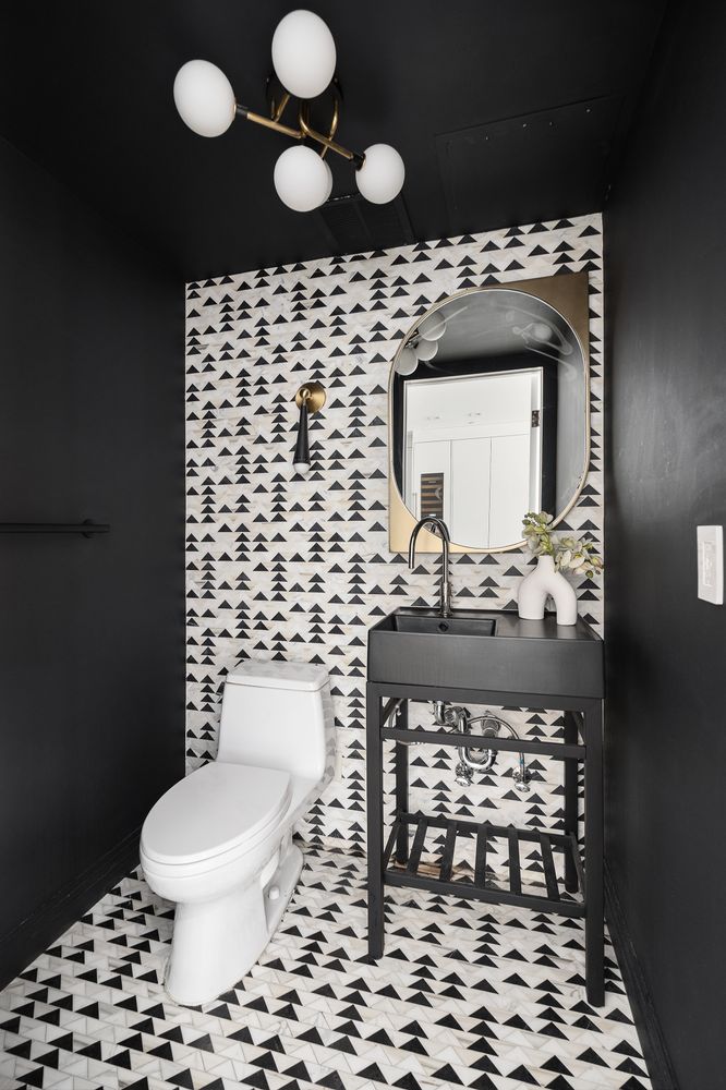 520 East 89th Street Manhattan, NY 10128 - Photo 36 of 40 a bathroom with a toilet a sink and a mirror