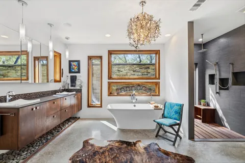 a bathroom with a sink a toilet and shower curtain