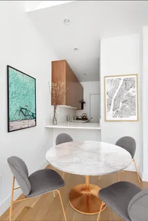 a living room with furniture and a painting