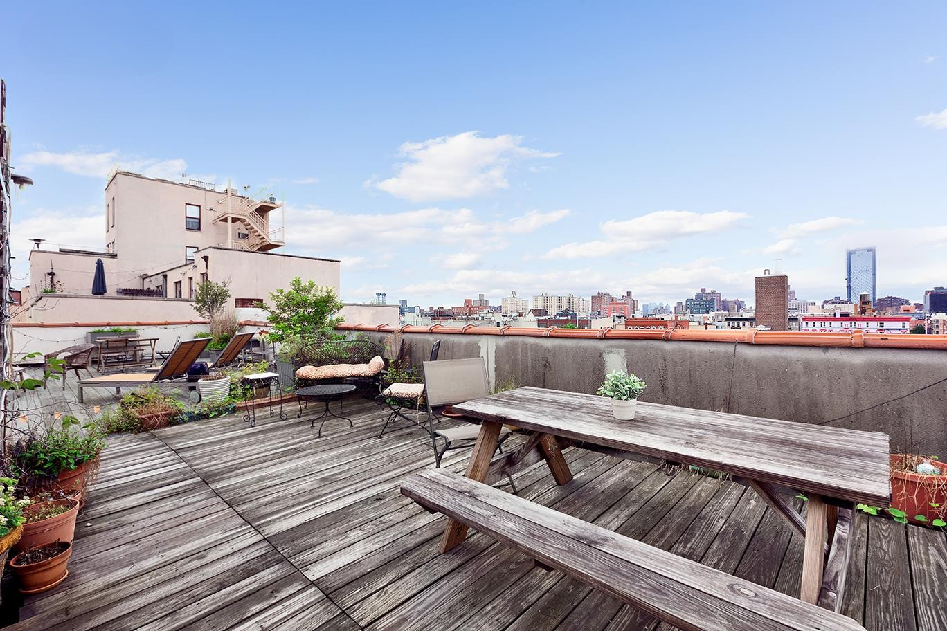 99 Avenue B, Unit 1B Manhattan, NY 10009 - Photo 6 of 8 a view of roof deck with seating space