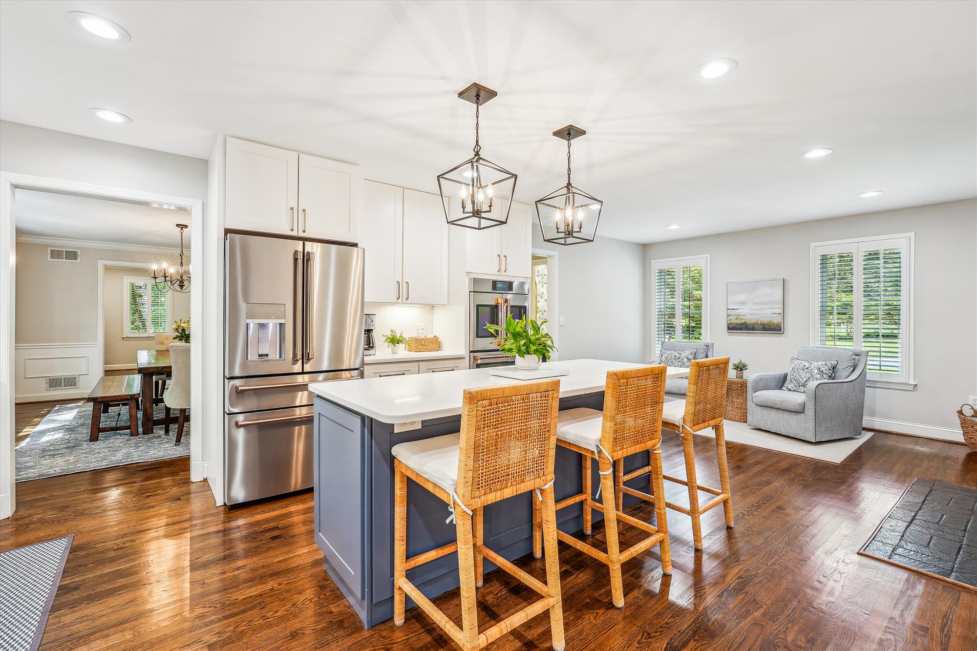 9904 Carter Road Bethesda, MD 20817 - Photo 11 of 41 a kitchen with stainless steel appliances granite countertop a dining table chairs refrigerator and couches