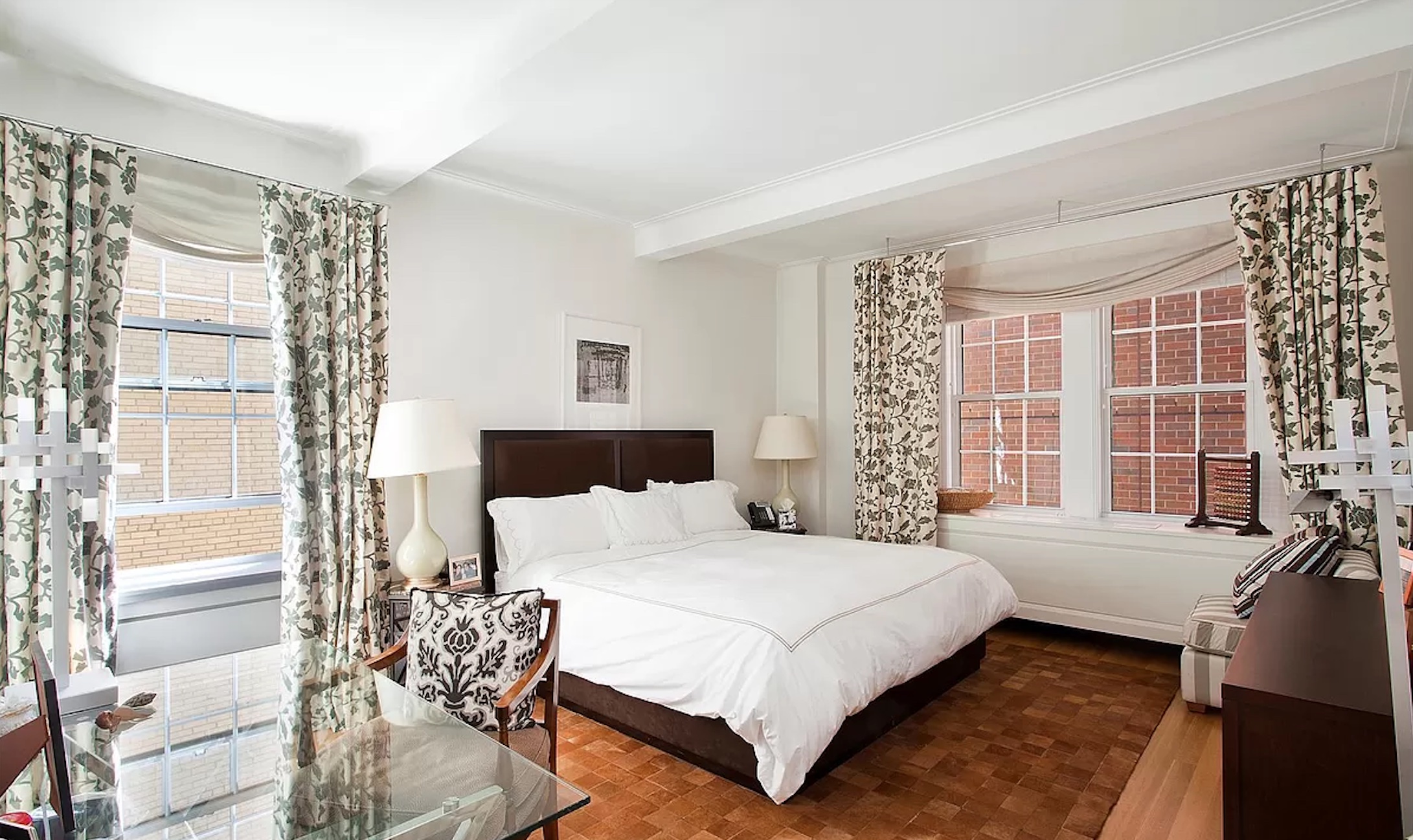 40 East 66th Street, Unit 8C Manhattan, NY 10065 - Photo 5 of 16 a bedroom with a bed and a couch