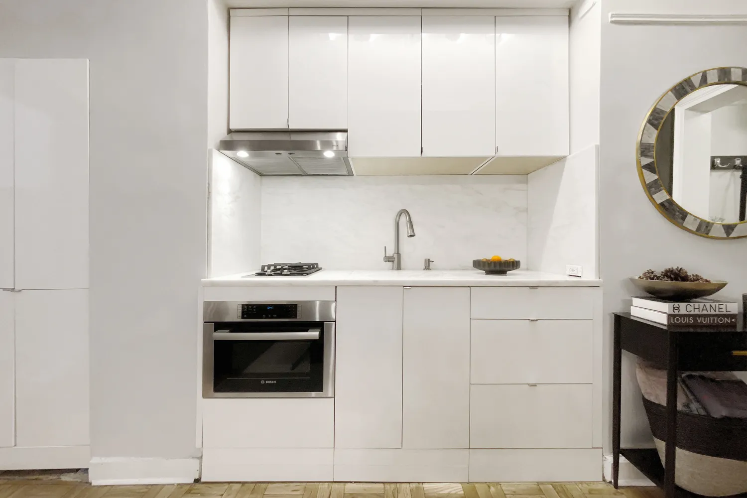 a kitchen with a stove and a sink