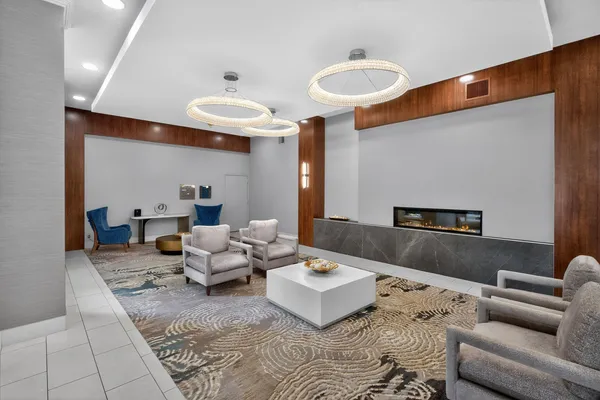 a living room with furniture and a rug