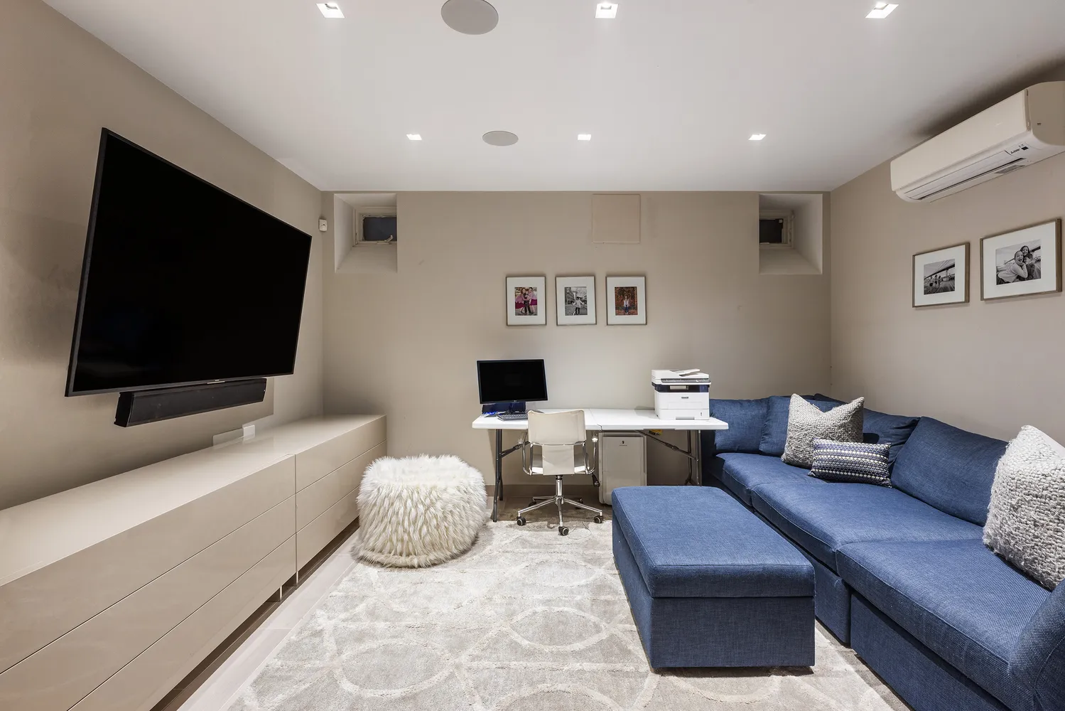 a patio with a table and chairs and potted plants