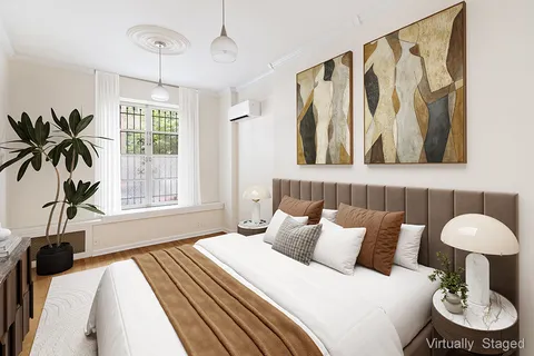 a bed room with a bed and a chair