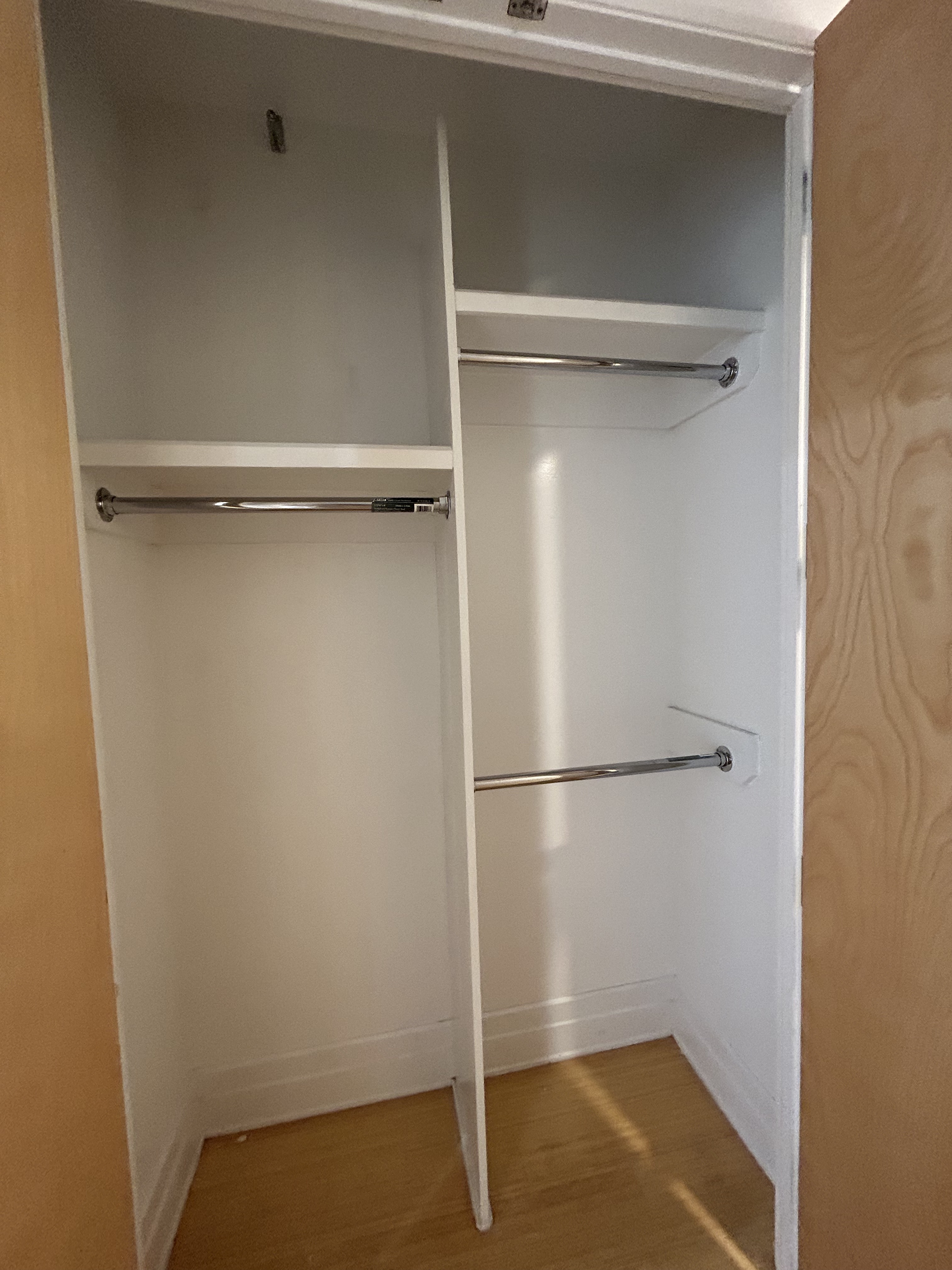 70 Washington Street, Unit 6Q Brooklyn, NY 11201 - Photo 7 of 12 a view of walk in closet with empty racks