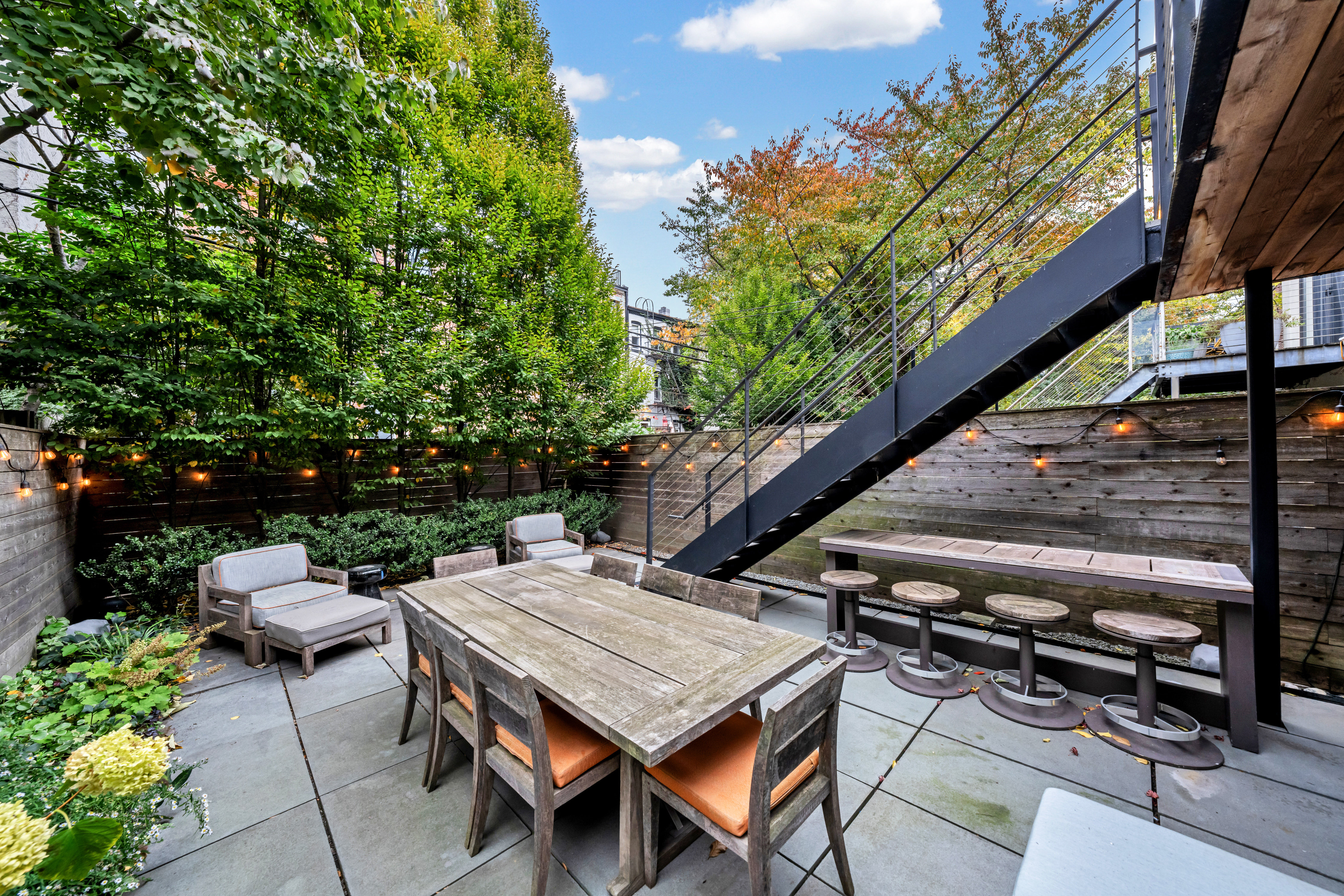 369 Union Street Brooklyn, NY 11231 - Photo 18 of 21 a wooden table and chairs sitting in the roof deck