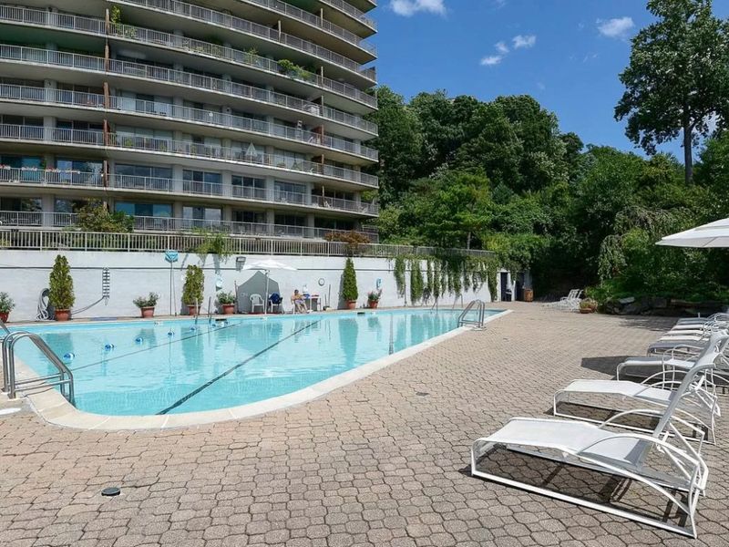 4455 Douglas Avenue, Unit 8A Bronx, NY 10471 - Photo 16 of 22 a view of backyard with swimming pool and outdoor seating