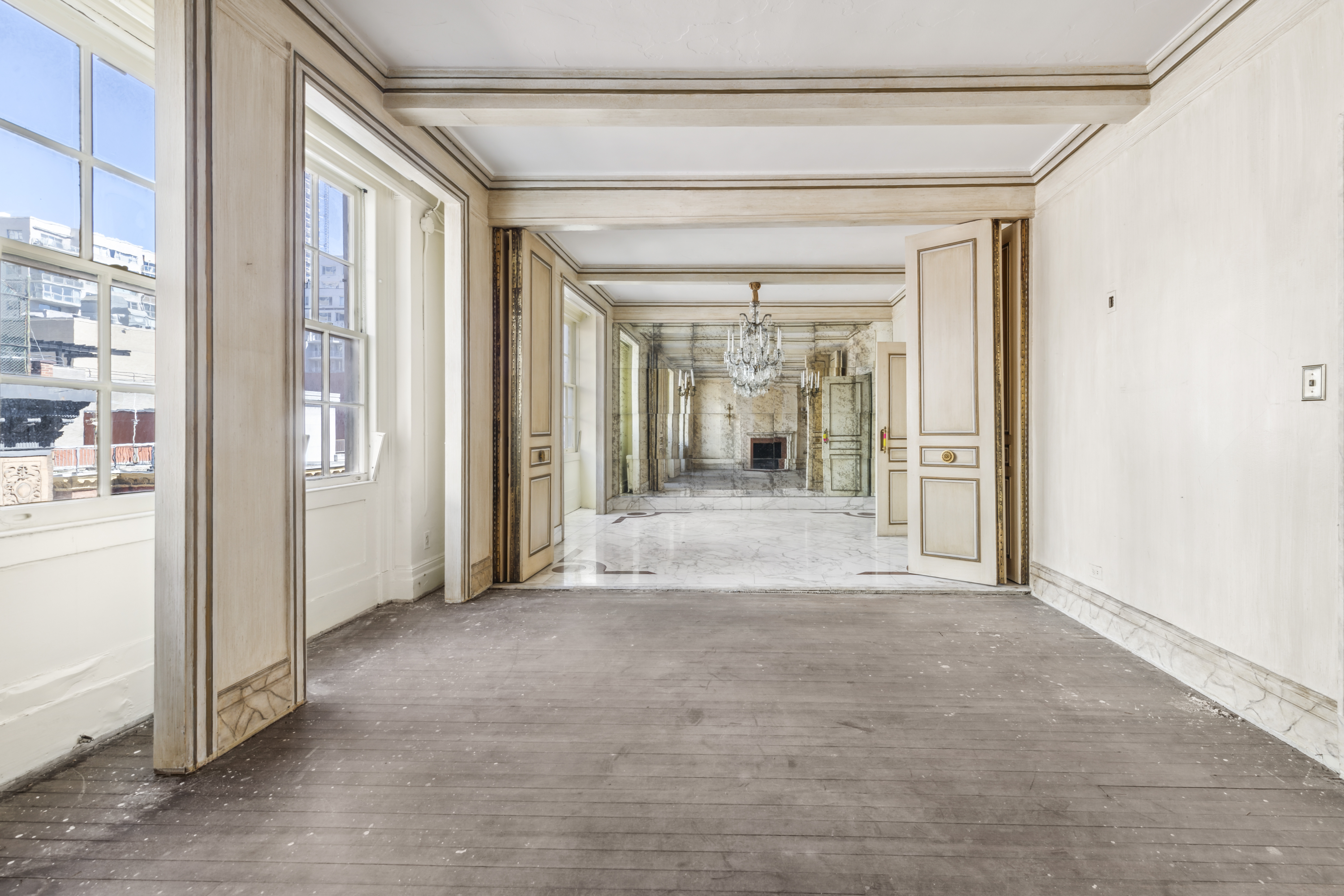 130 East 67th Street, Unit 9C Manhattan, NY 10065 - Photo 7 of 20 a view of a hallway with wooden shelves