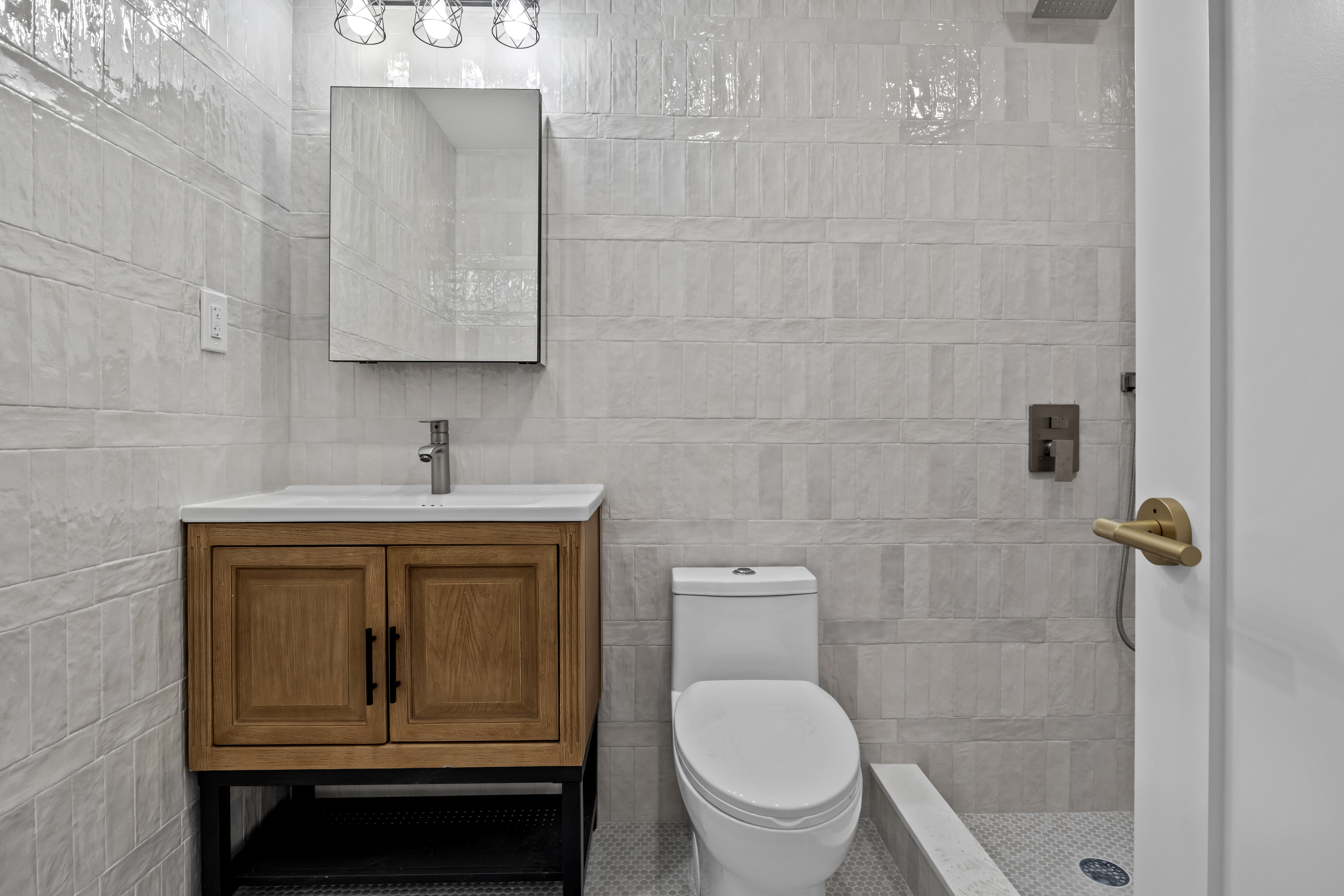 320 10th Street Brooklyn, NY 11215 - Photo 28 of 41 a bathroom with a toilet sink a shower and mirror