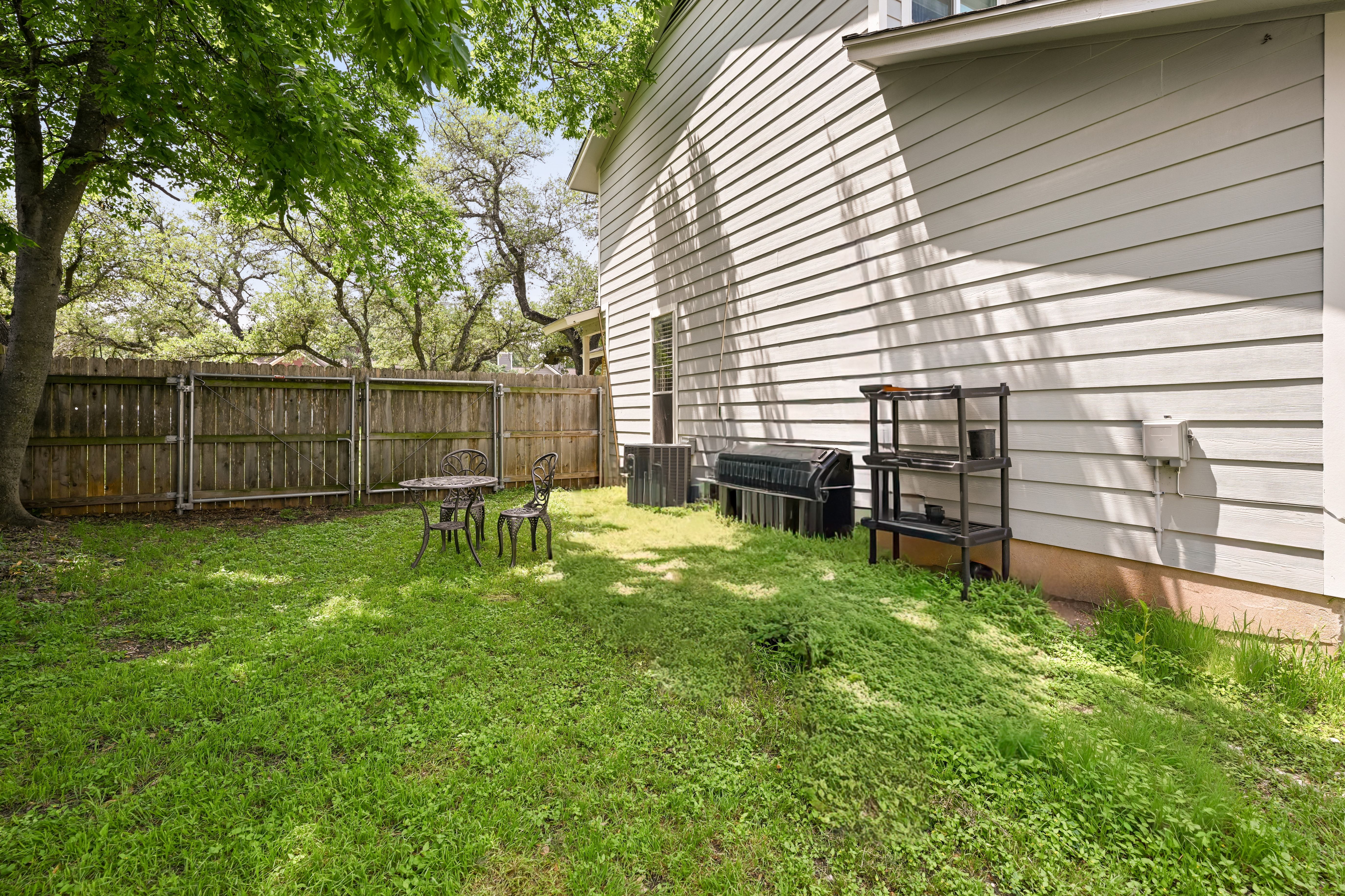 8710 Clearbrook Trail Austin, TX 78729 - Photo 15 of 28 a view of a backyard with a garden