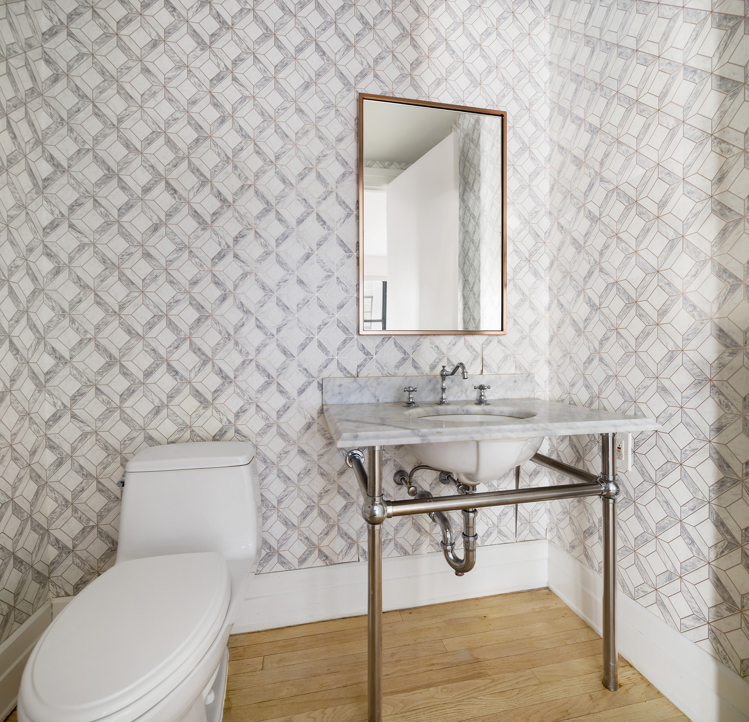 30 Main Street, Unit 3C Brooklyn, NY 11201 - Photo 12 of 18 a bathroom with a toilet sink and mirror