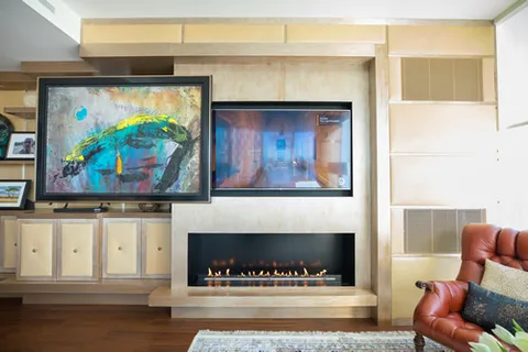 a living room with furniture and a fireplace