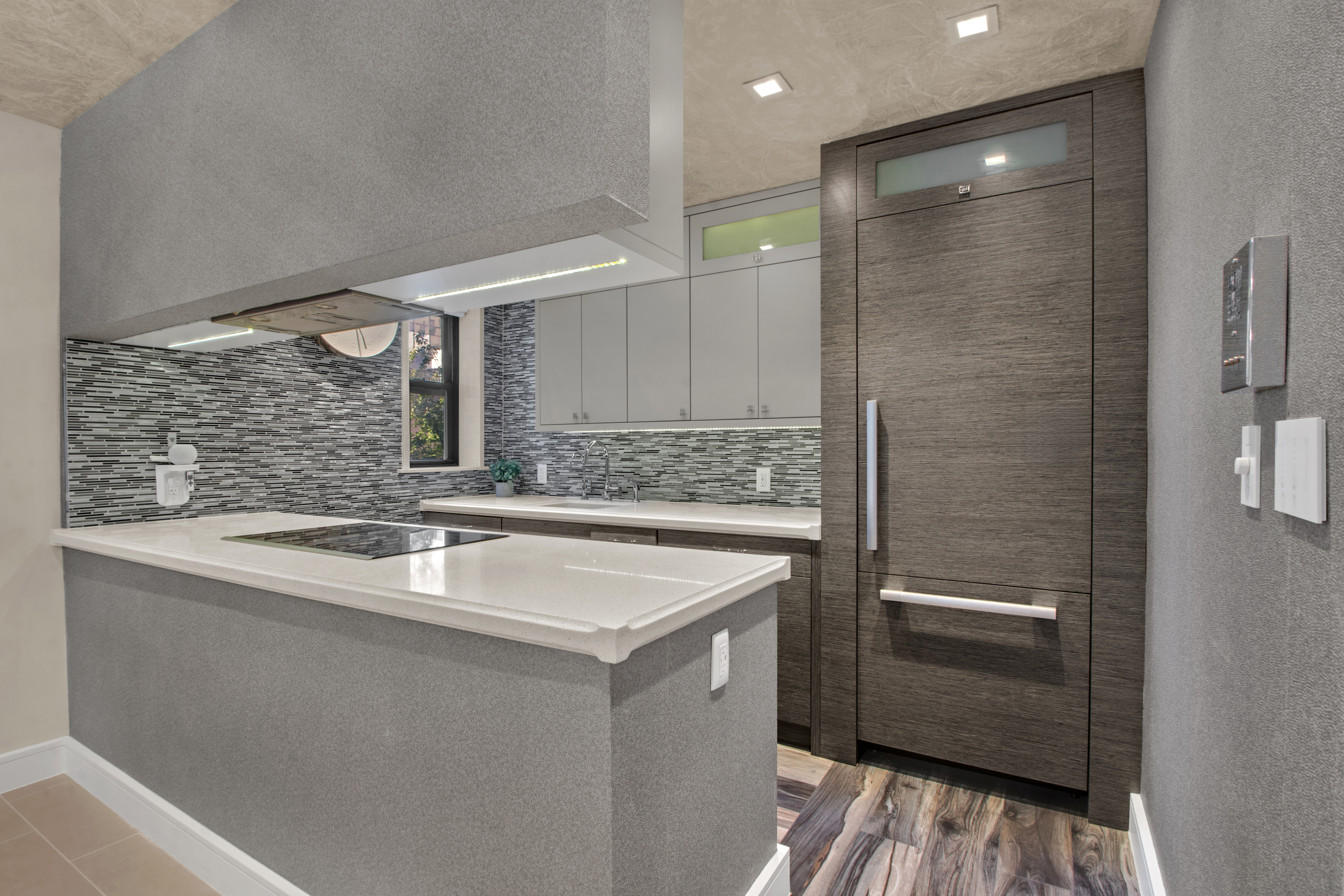 690 Washington Street, Unit 1A Manhattan, NY 10014 - Photo 4 of 17 a kitchen with a sink and a refrigerator