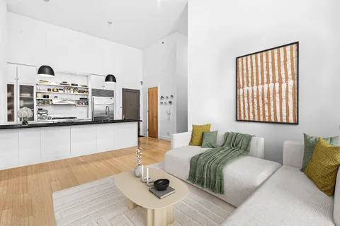a living room with furniture rug and window