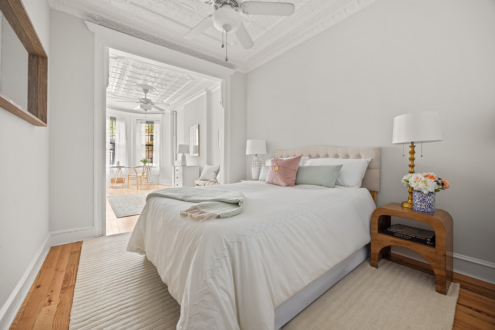 162 Garfield Place, Unit 1L Brooklyn, NY 11215 - Photo 7 of 13 a bedroom with a bed and a chandelier