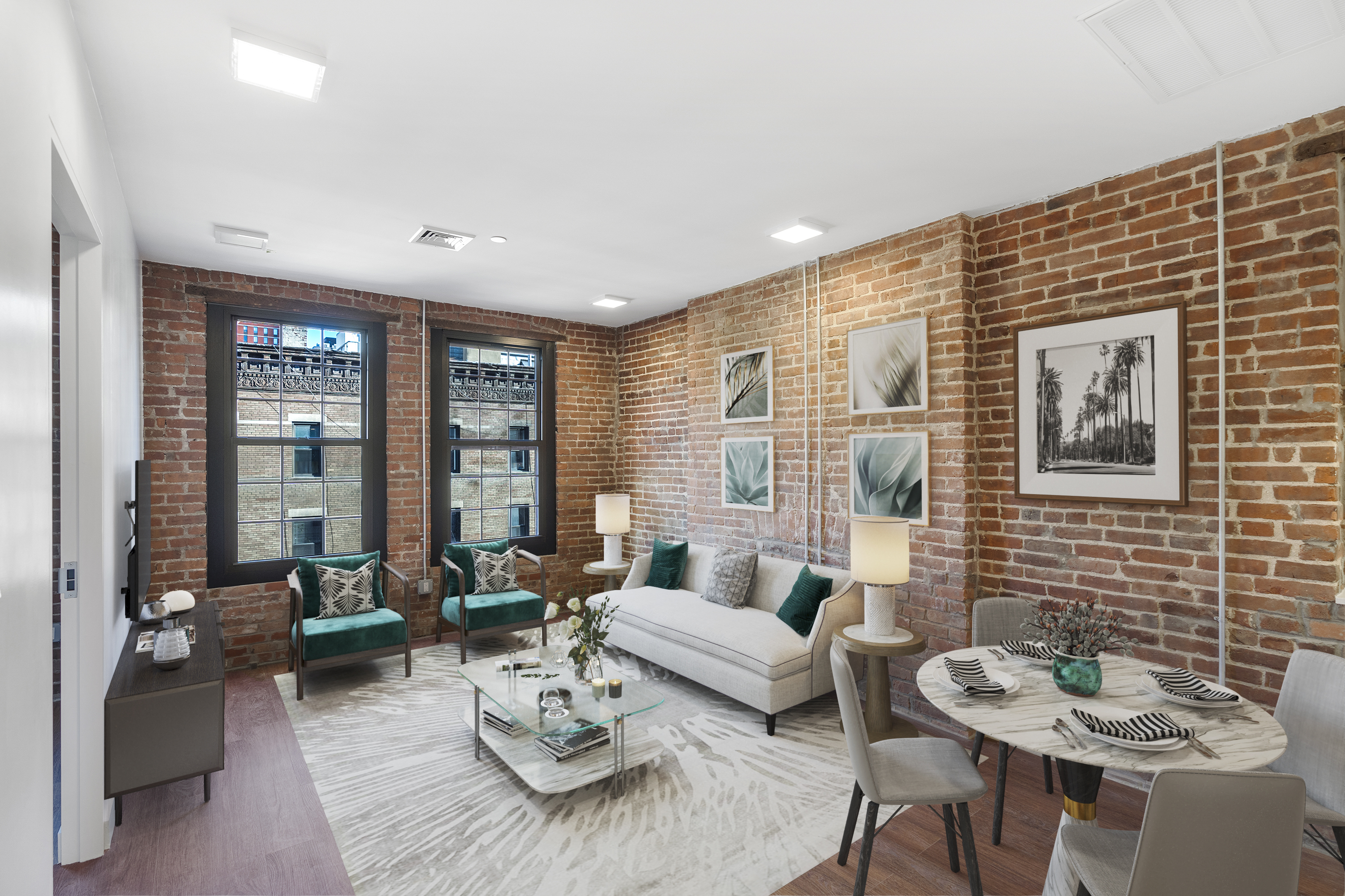 a living room with furniture and floor to ceiling window