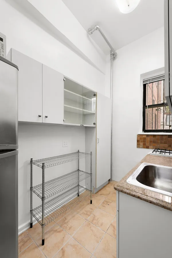 a bathroom with a sink and shower
