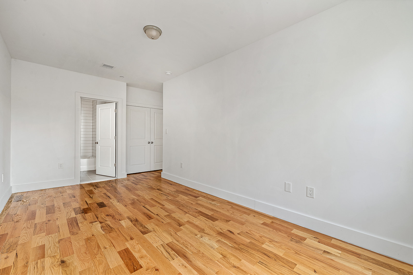 422 East 31st Street Brooklyn, NY 11226 - Photo 9 of 16 a view of empty room with wooden floor