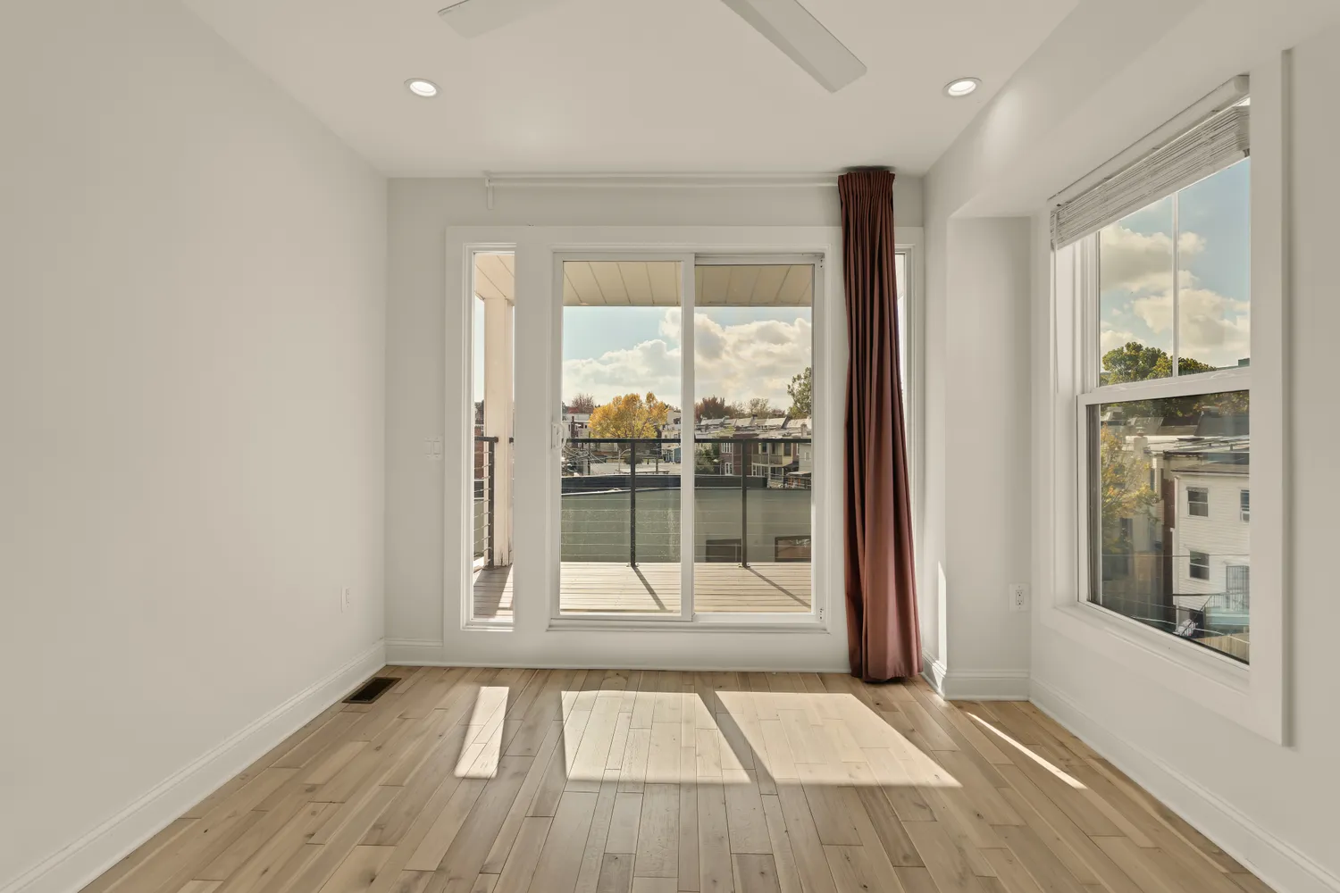a view of an empty room with glass door