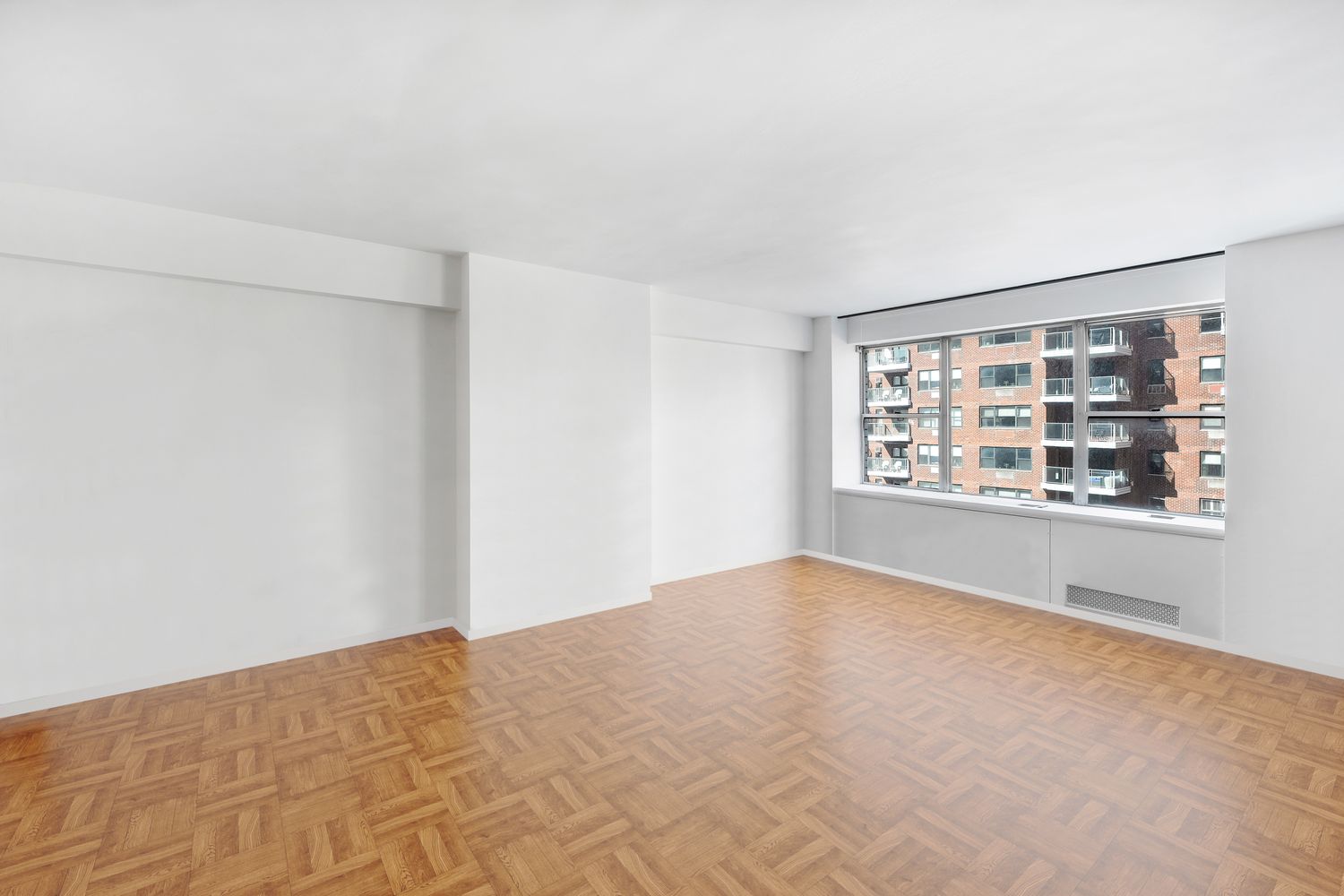 45 Sutton Place South, Unit 16B Manhattan, NY 10022 - Photo 9 of 19 a view of an empty room with a window