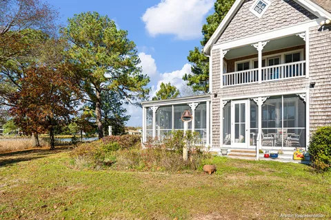 a view of house with yard