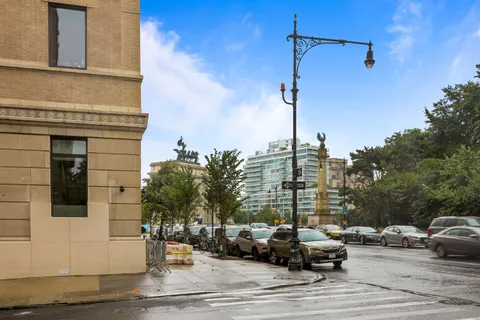 a view of street with parked cars