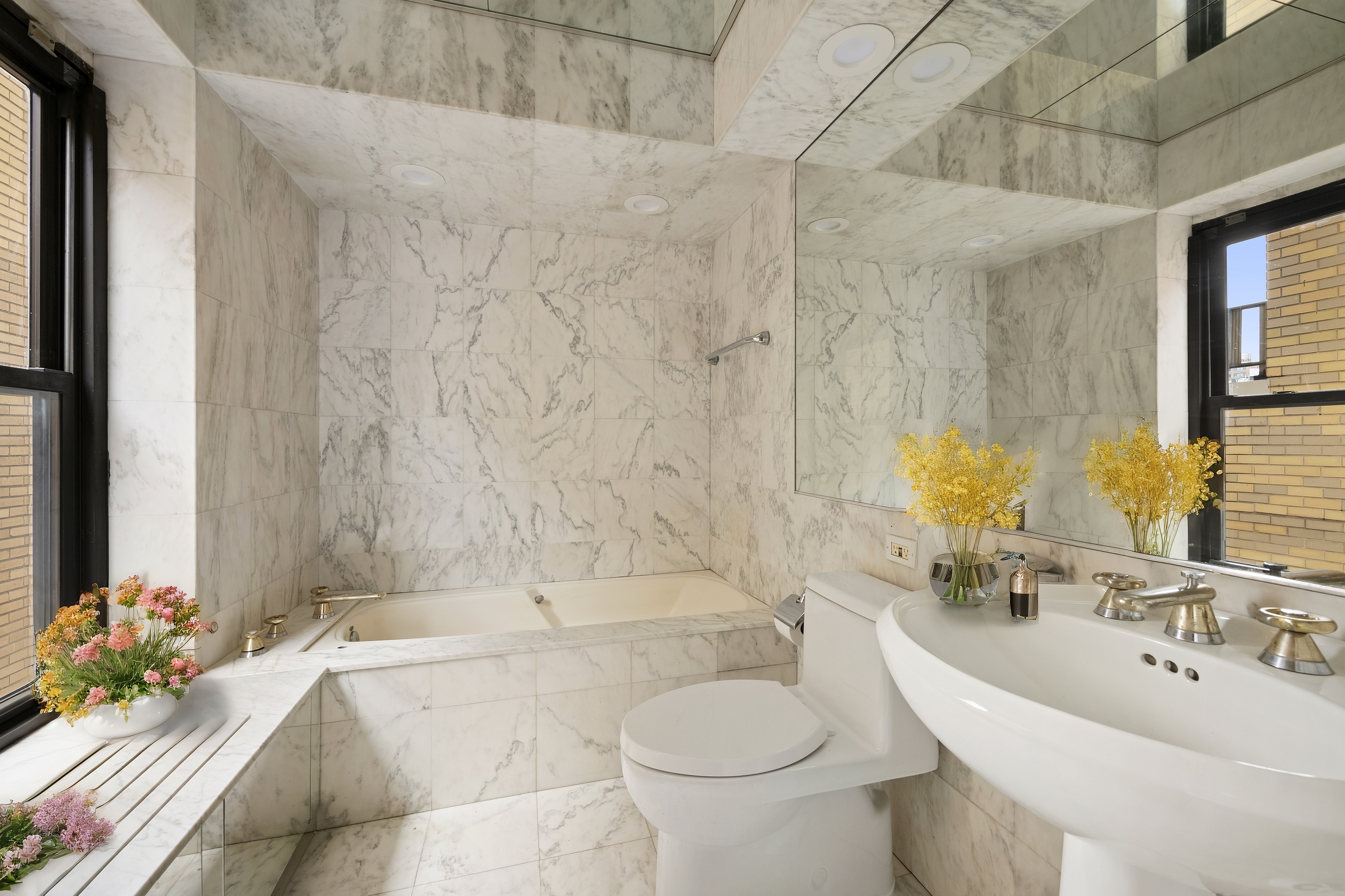 315 West 23rd Street, Unit 3E Manhattan, NY 10011 - Photo 6 of 10 a bathroom with a sink toilet and shower