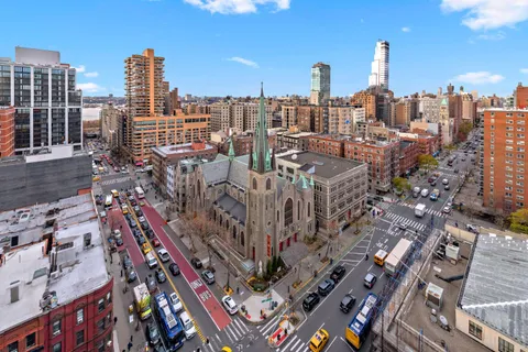 a view of a city with tall buildings