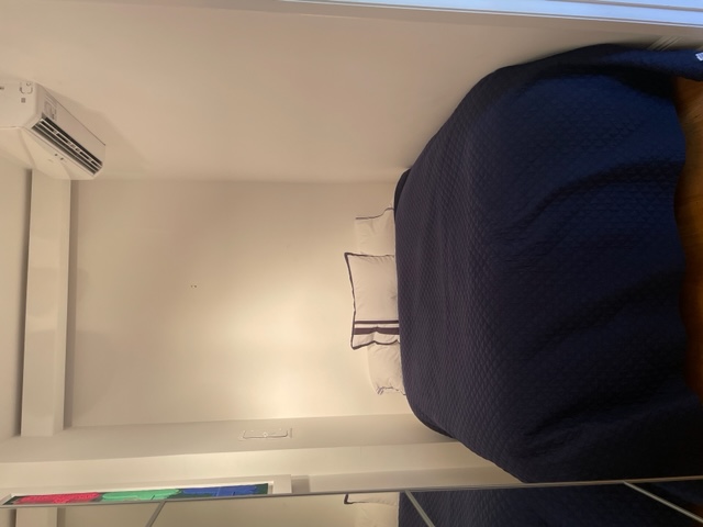 128 East 62nd Street, Unit 4F Manhattan, NY 10065 - Photo 6 of 9 a bedroom with a bed and a window