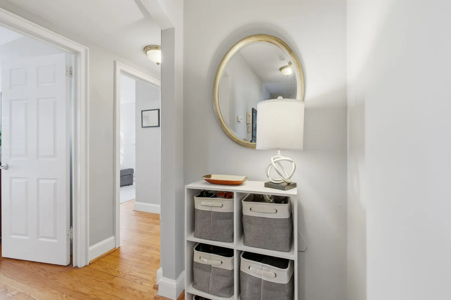 a room with a mirror and a bathroom