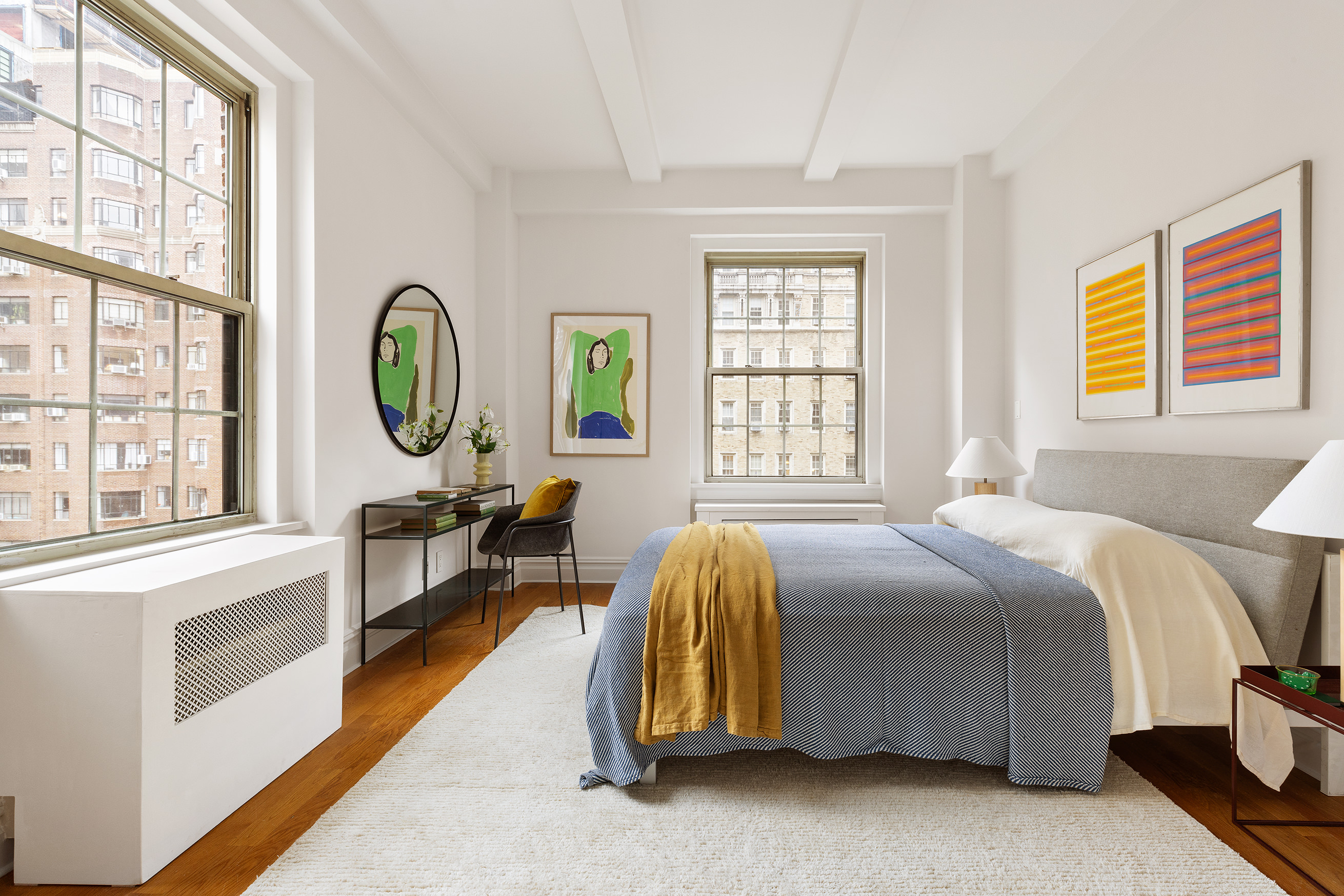 25 5th Avenue, Unit 9A Manhattan, NY 10003 - Photo 8 of 16 a bed room with a bed and a window