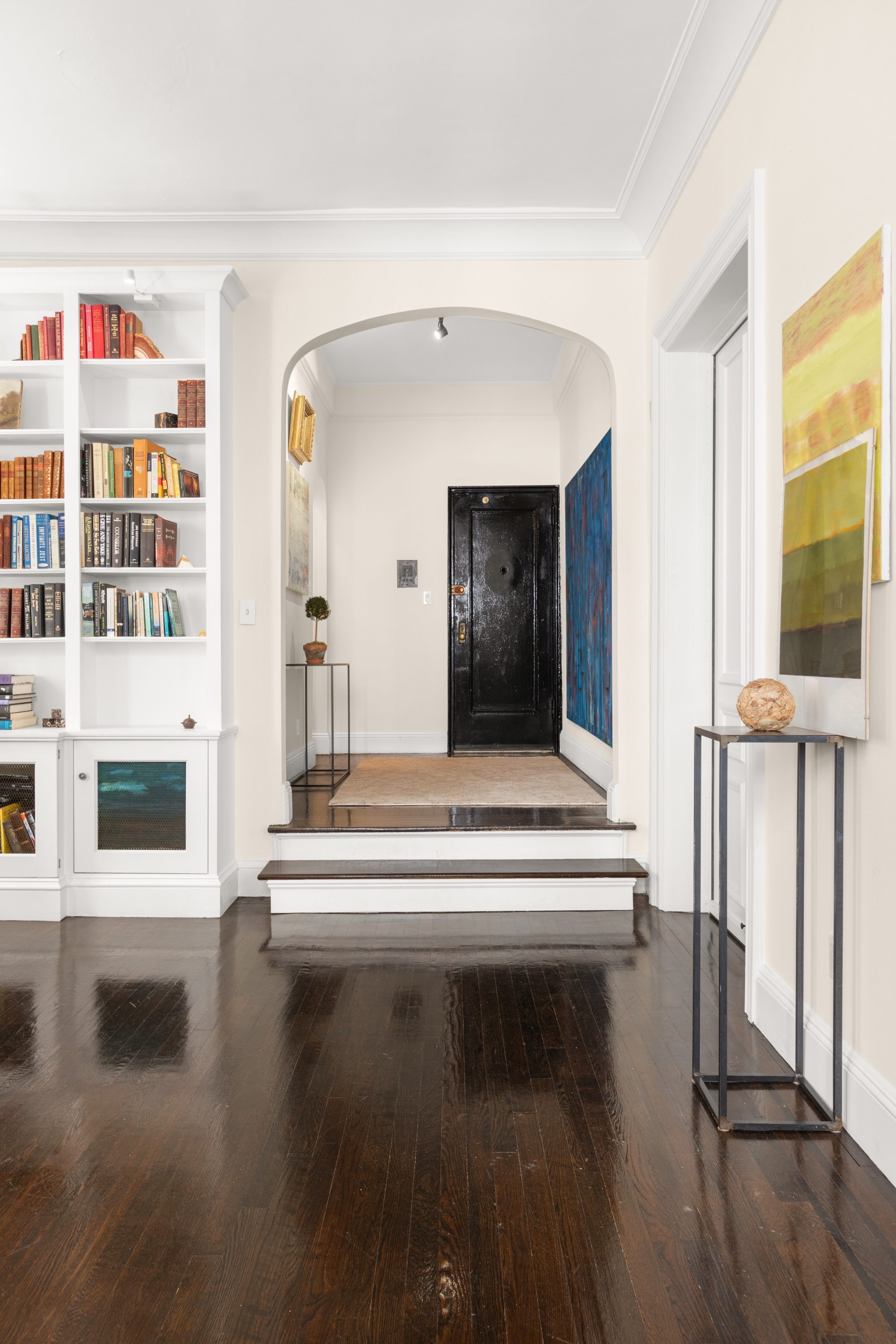 51 East 78th Street, Unit 3BC Manhattan, NY 10075 - Photo 10 of 25 a living room with furniture and a flat screen tv