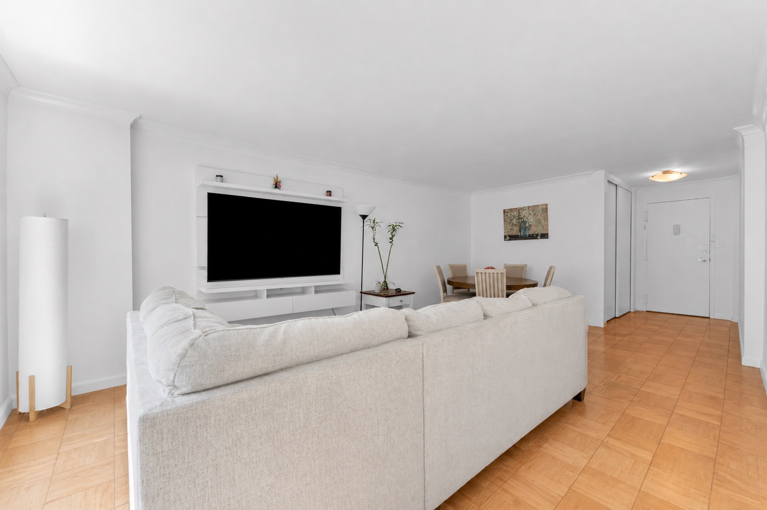 150 West End Avenue, Unit 10P Manhattan, NY 10023 - Photo 6 of 17 a living room with furniture and a flat screen tv