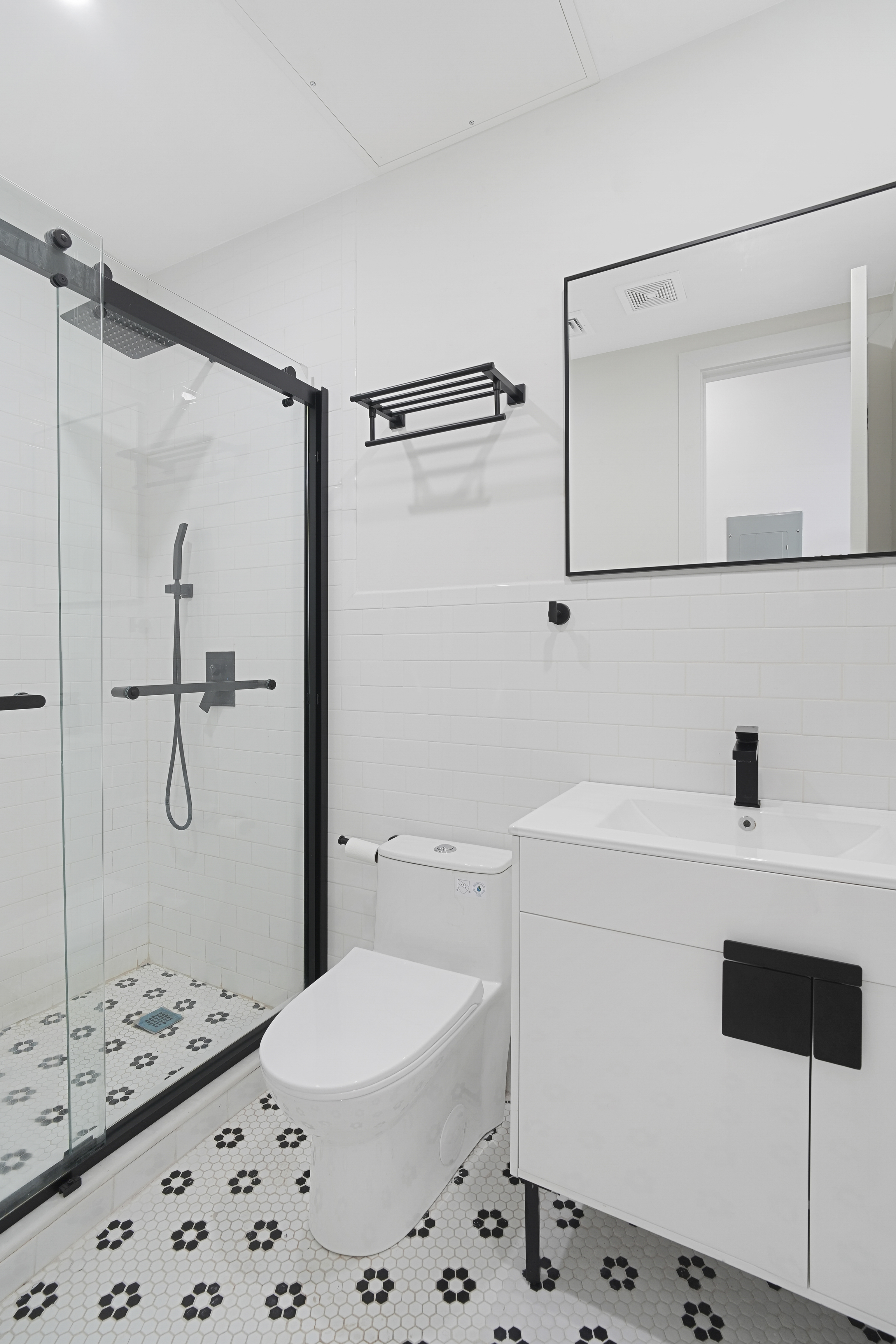 1390 Eastern Parkway Brooklyn, NY 11233 - Photo 6 of 19 a bathroom with a sink a toilet and shower