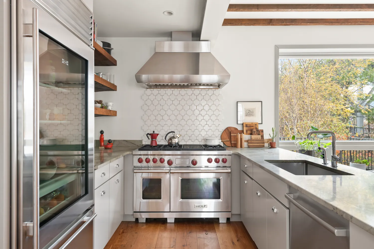 a kitchen with a stove and a sink