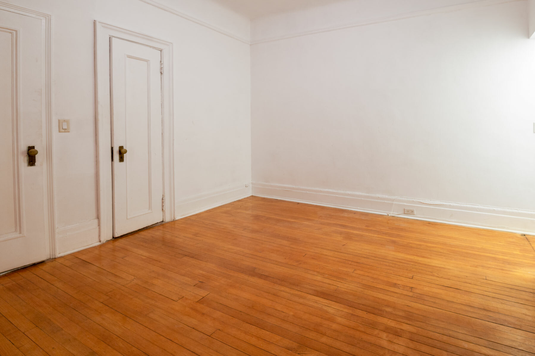 26 East 63rd Street, Unit 2E Manhattan, NY 10065 - Photo 7 of 8 a view of empty room with wooden floor